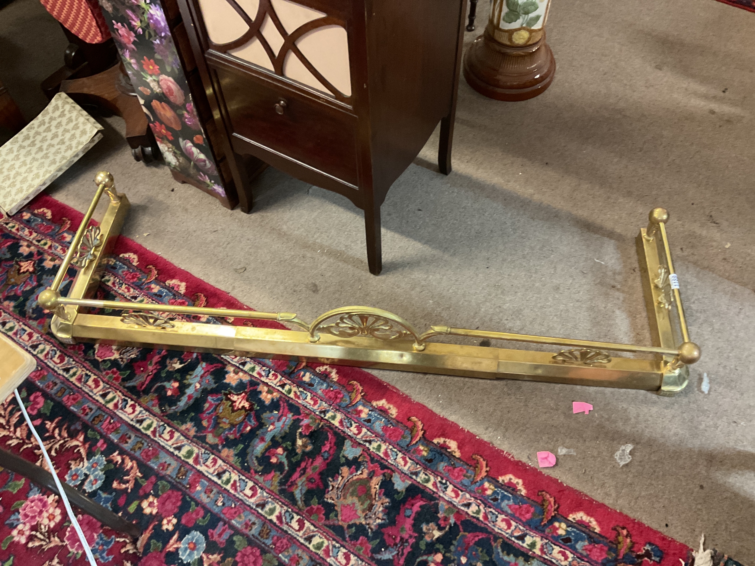 Brass ornate fender.which extends TO BE SOLD WITHOUT A RESERVE