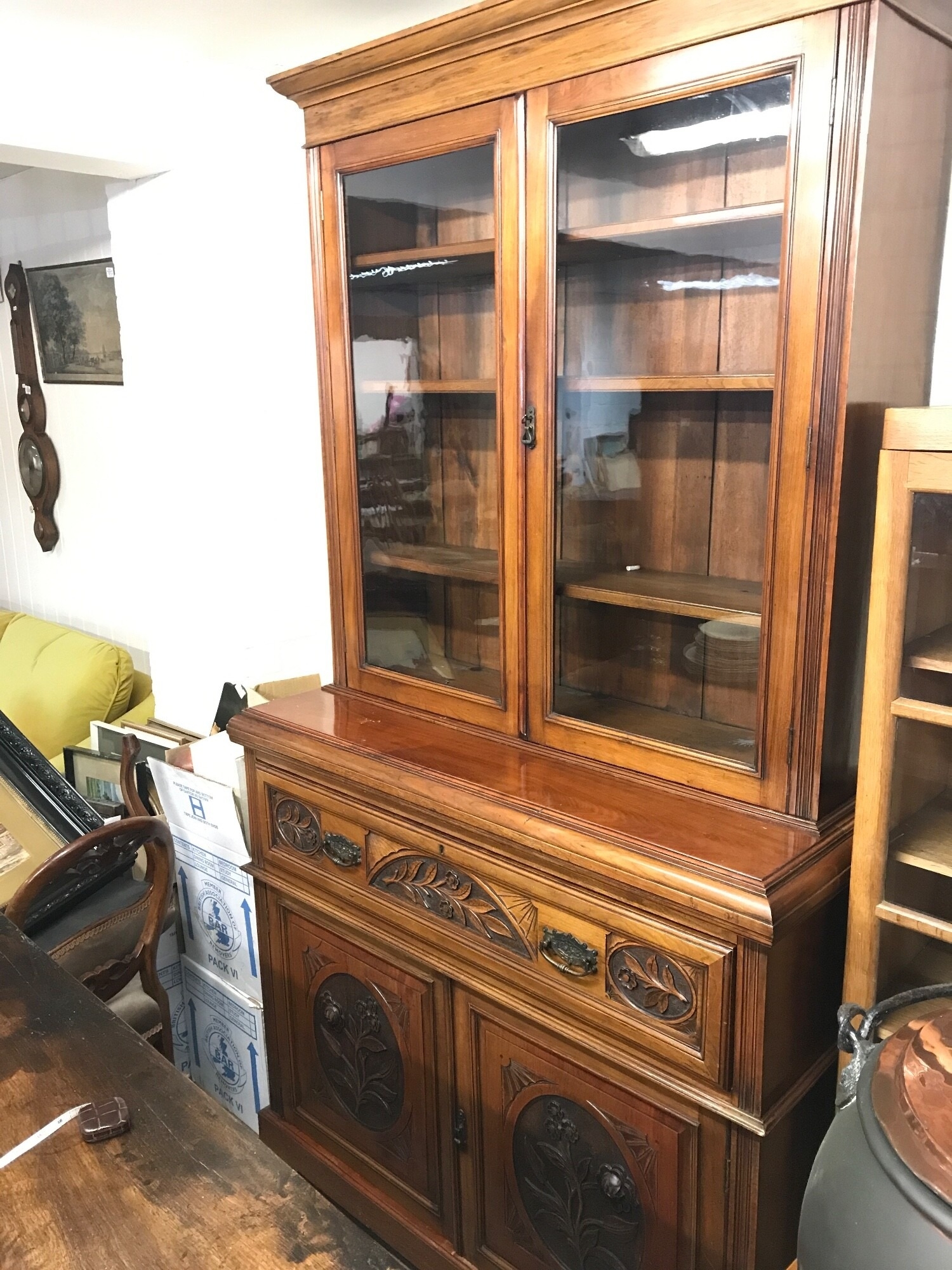 A walnut secretaire bookcase with carved floral design. 221cm tall. 51cm deep, 122cm wide TO BE SOLD WITHOUT RESERVE