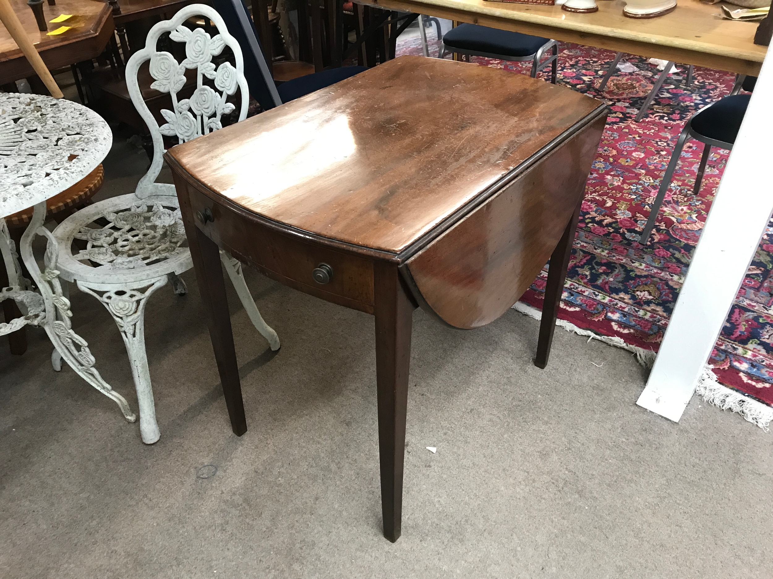 A mahogany Pembroke table with a drop-leaf design. 76cm wide 52cm long, 70cm tall