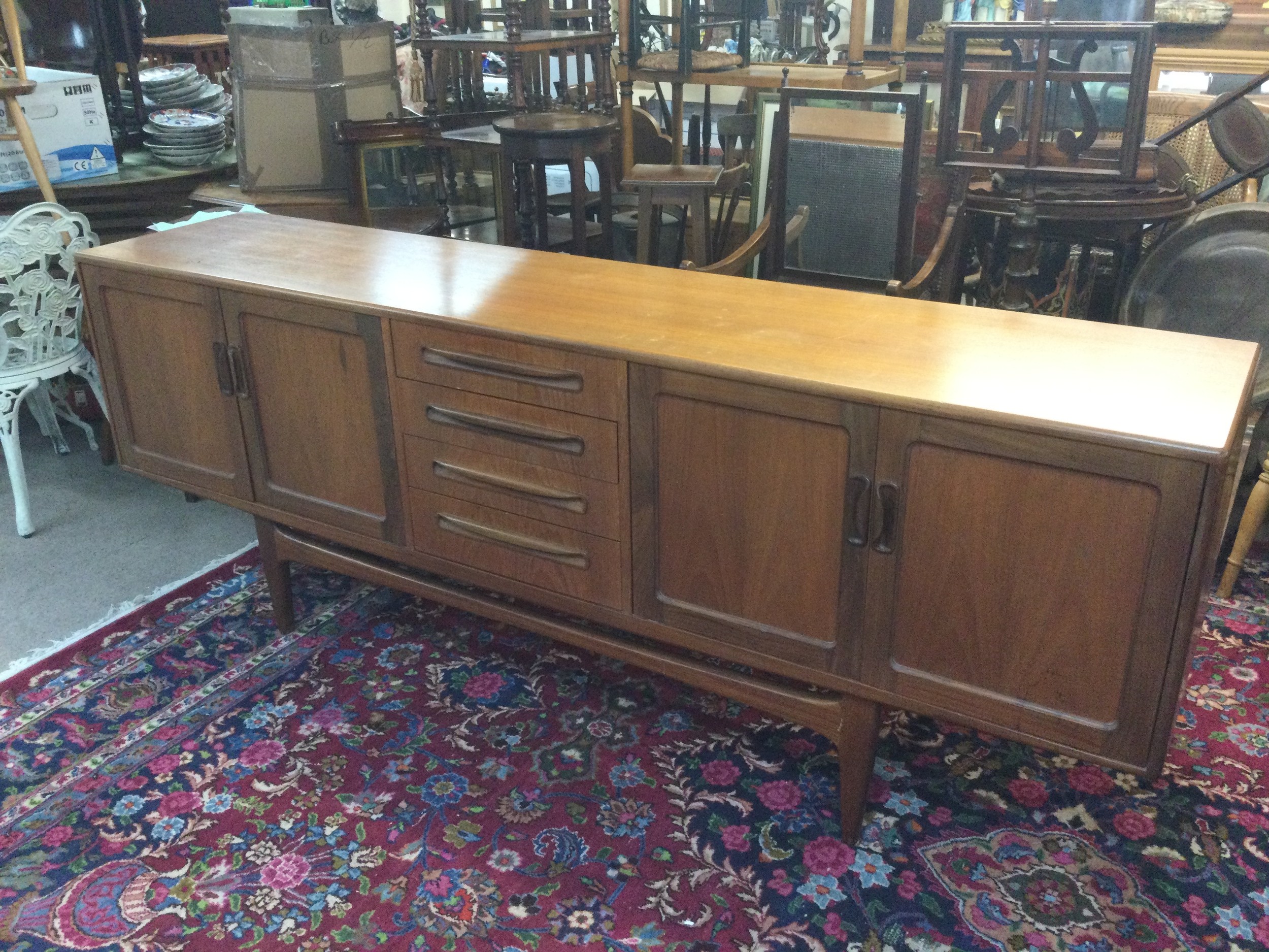 A mid-century modern "Long John" teak sideboard. 46cm long 213cm wide 80cm tall