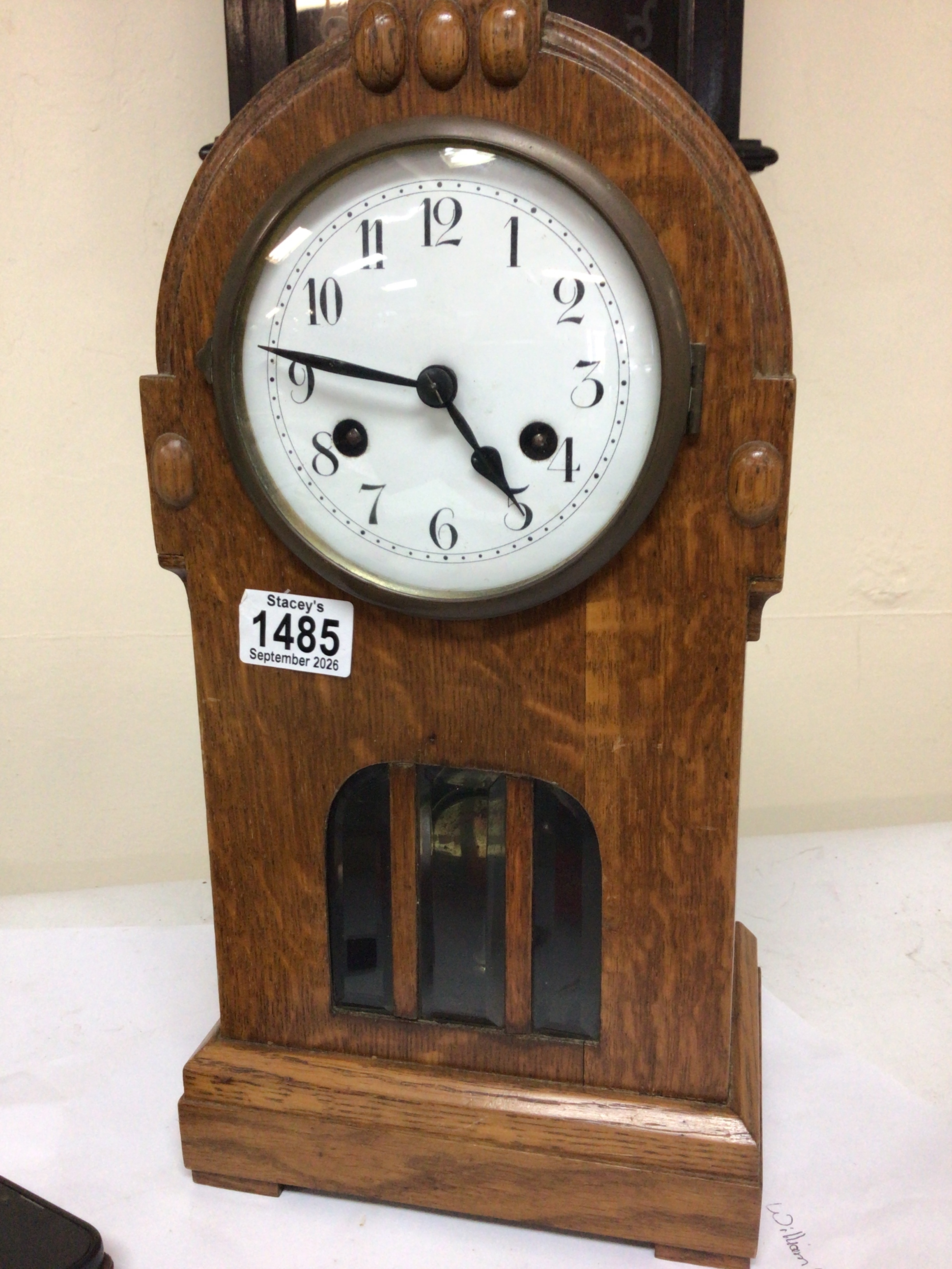  A continental Jugendstil influence oak mantel clock with a visible pendulum Height 40cm 
