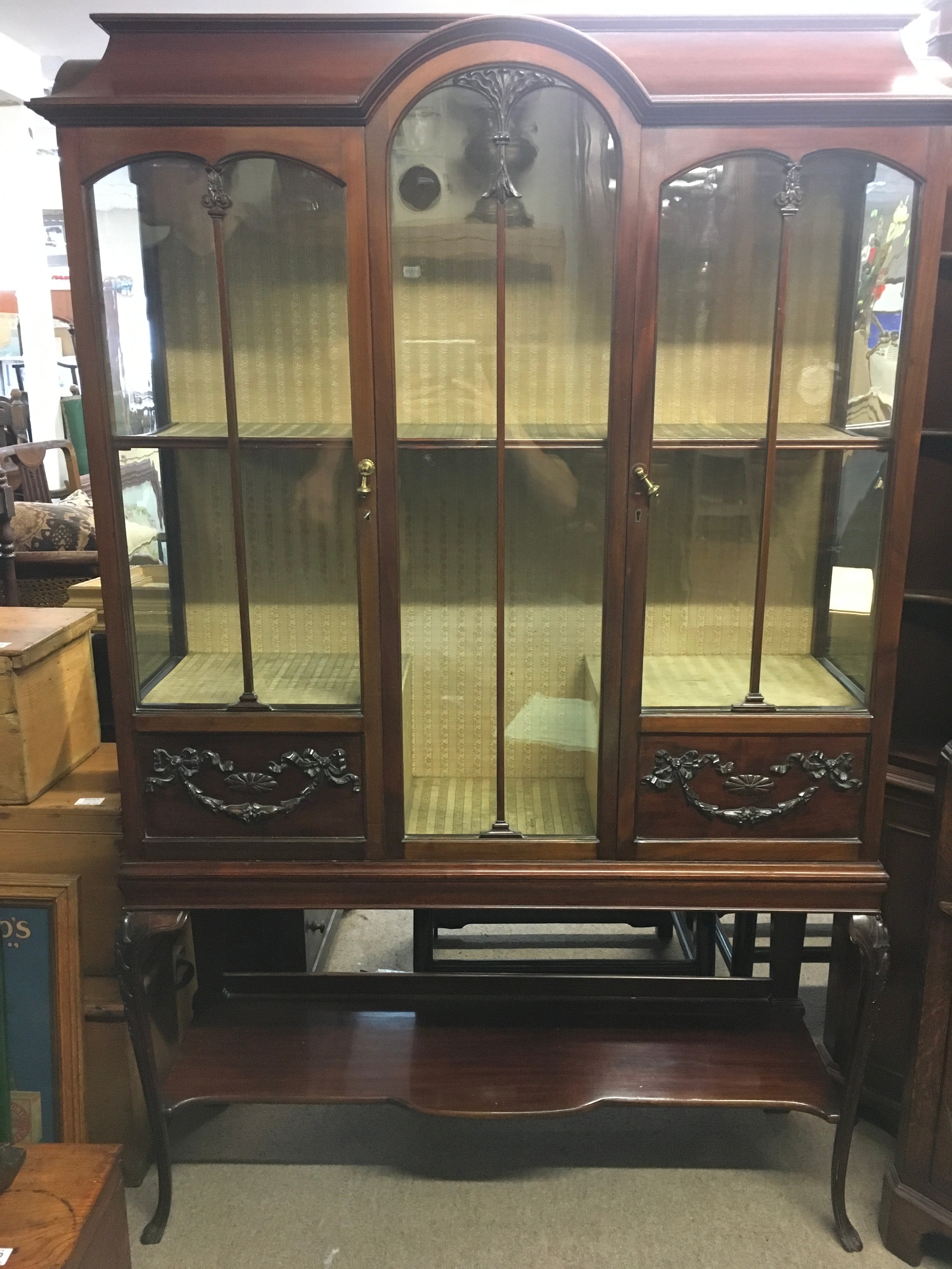 A display cabinet. Height 166cm, Width 102cm. 