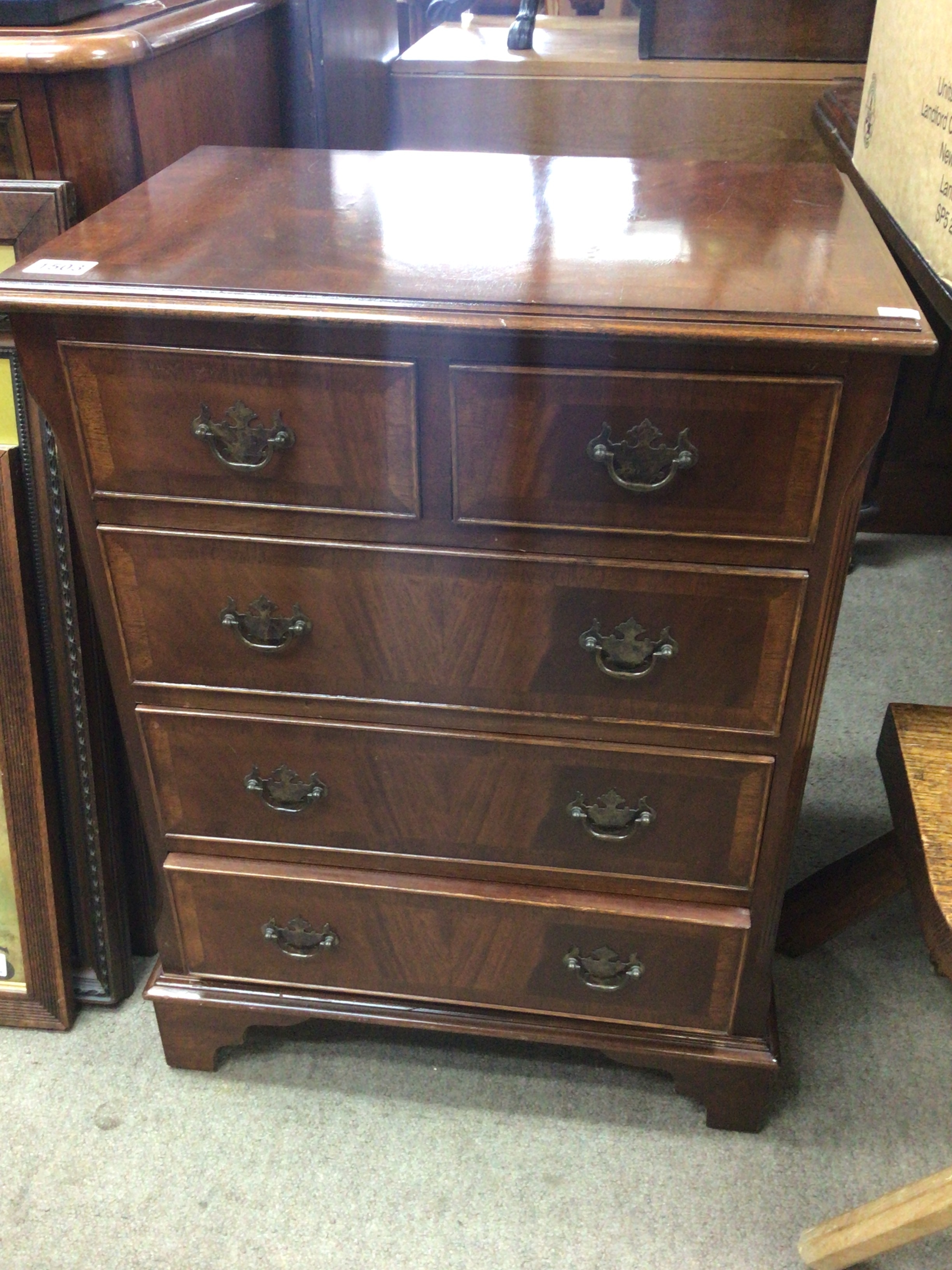  A mahogany chest of drawers of small size with two drawers above three further drawers on bracket feet. 75x56cm 