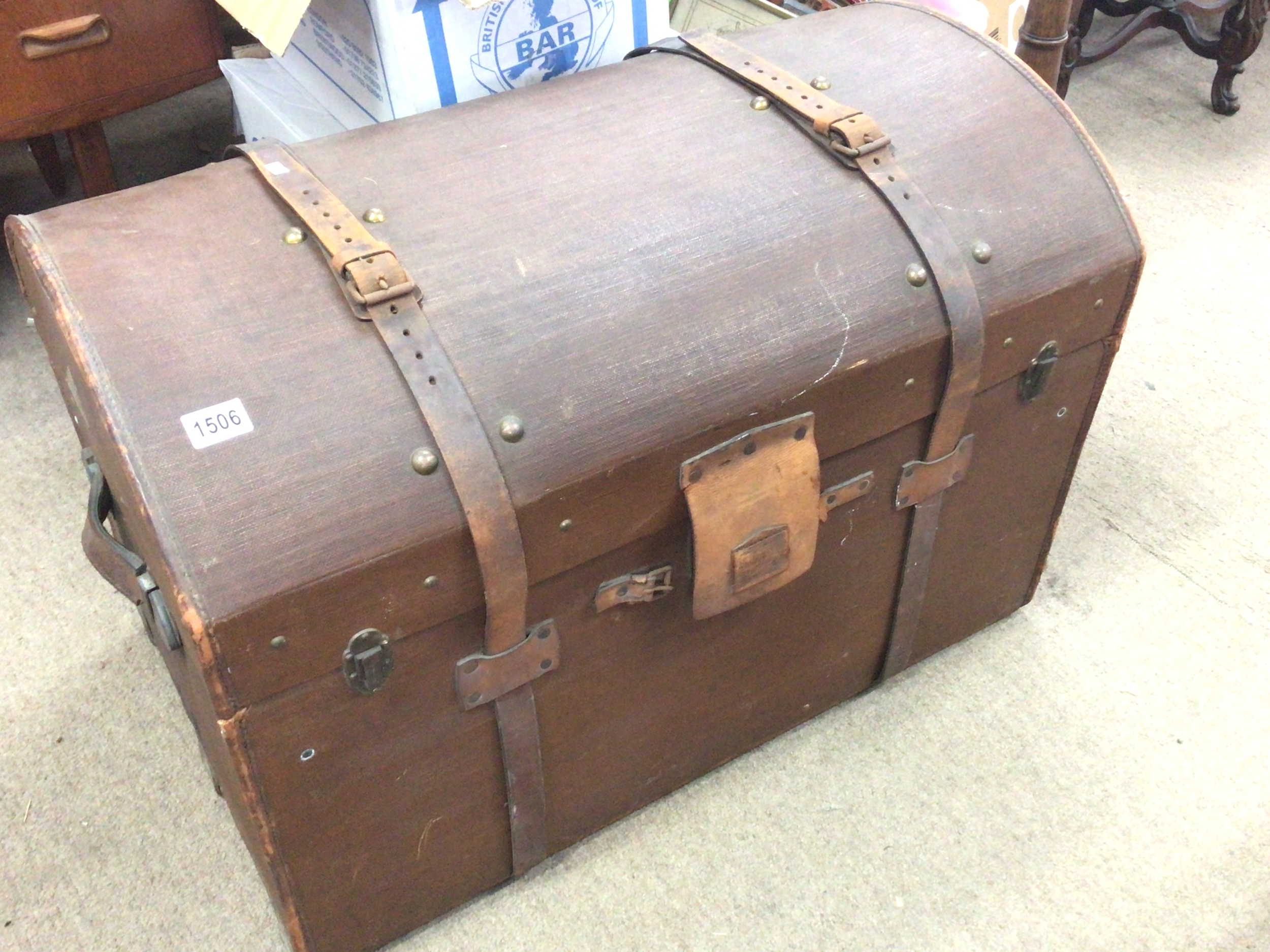  A quality Early 20th century canvas and leather steamer travelling trunk with a dome top and leather straps and handles, with the trade mark applied maker Liprostra Dresden made and used during the Titanic era. 85cm long height 60cm 