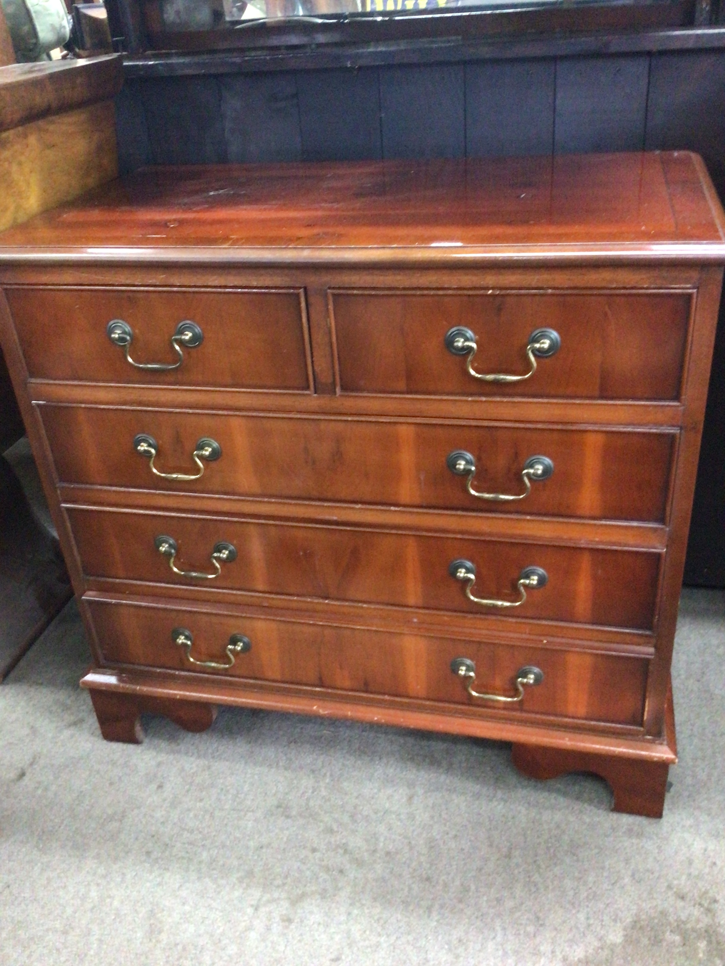  A Yew wood chest of drawers fitted with two short and three long drawers 67x70cm