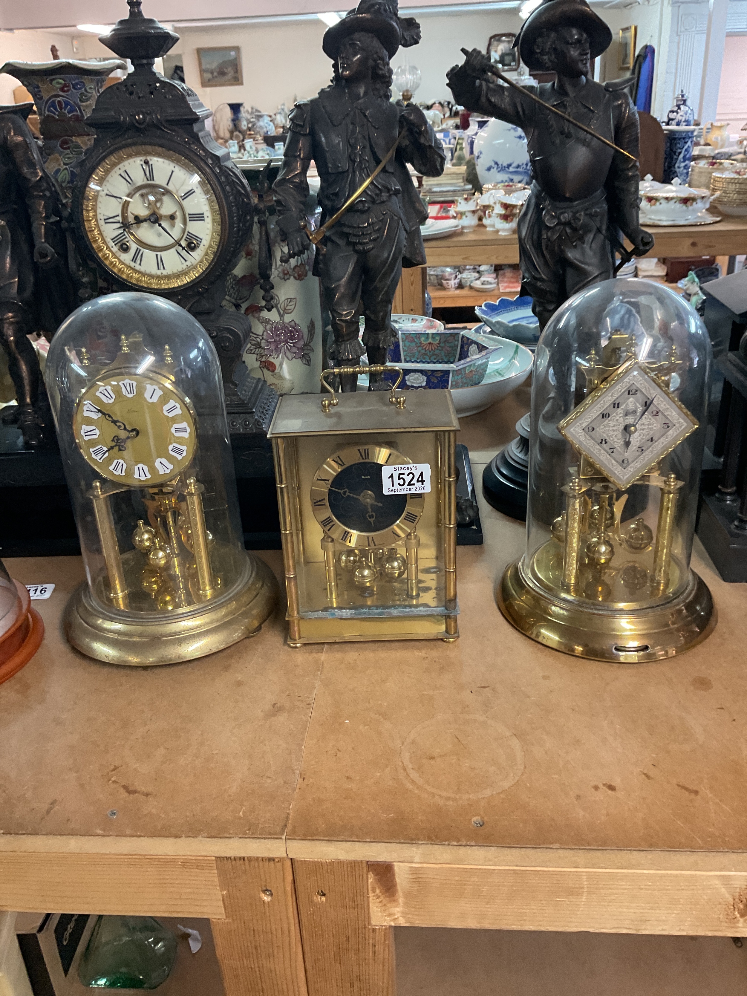 Three brass anniversary clocks.