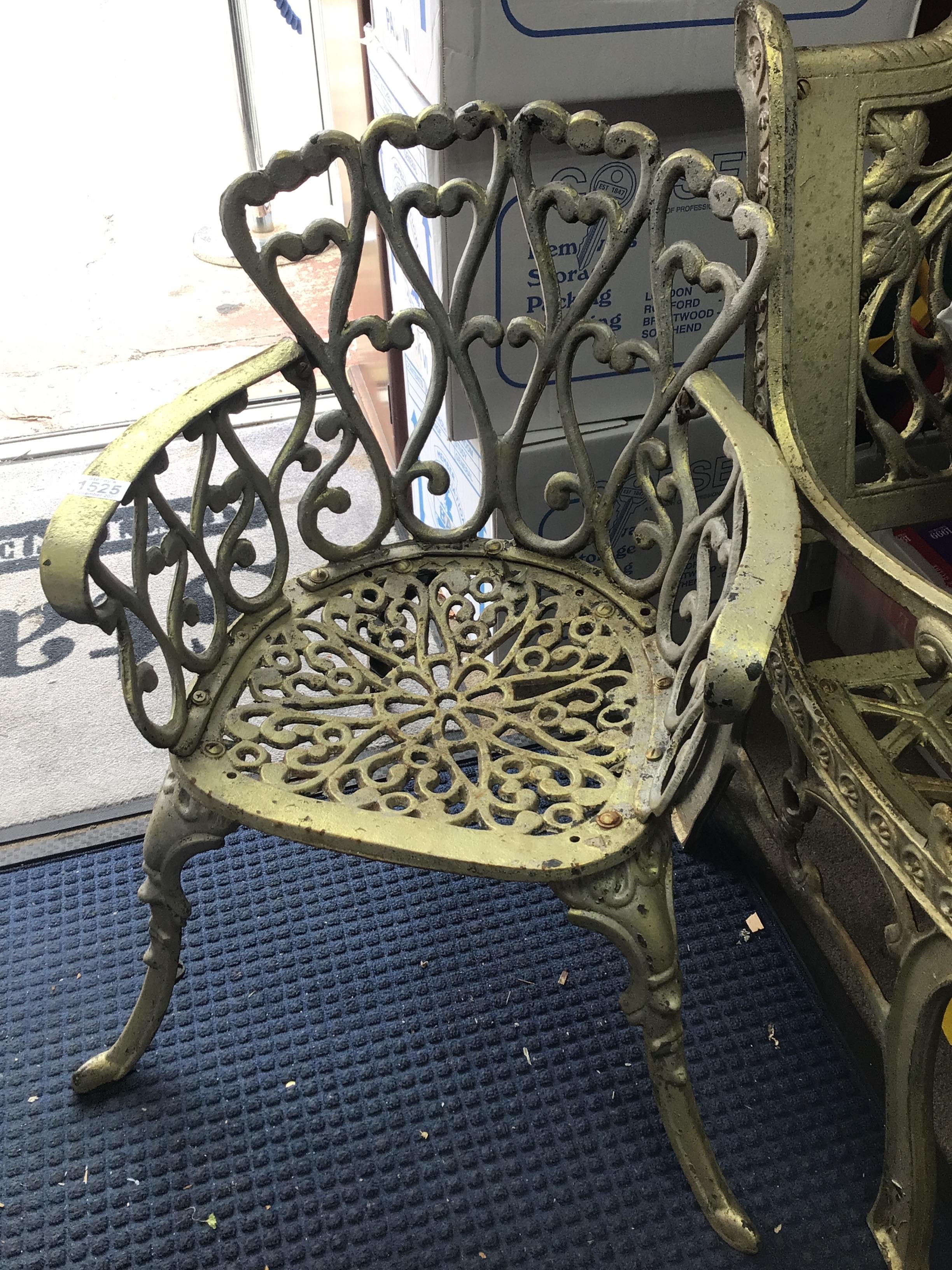  A Cast metal garden seat with open scrolls. 