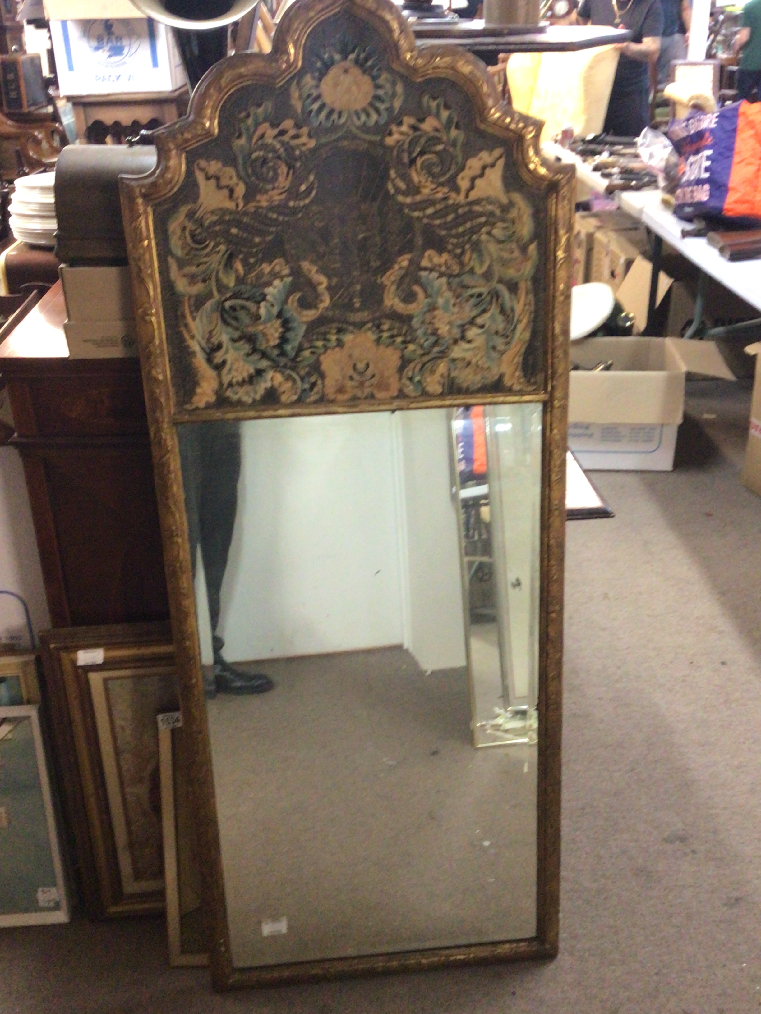  A late 19th century decorative gilt framed  wall mirror, the top with an embroidered panel above a rectangular beveled edge plate.  