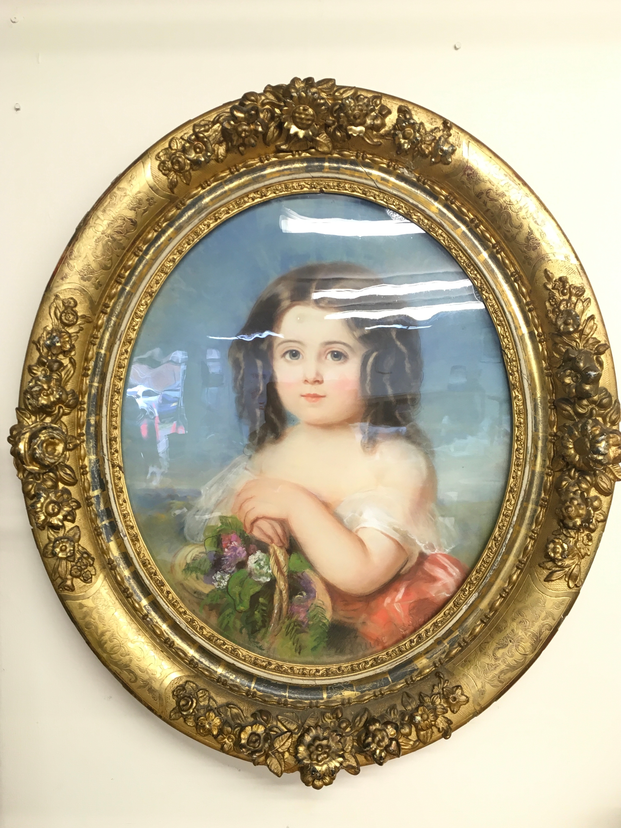 A 19th century French pastel portrait painting by Laure Houssaye De Leomenil Nee Girand (1806-1866) of a young girl in an oval gilt floral frame. Frame 74cm tall, 64cm wide. Picture 43x53cm