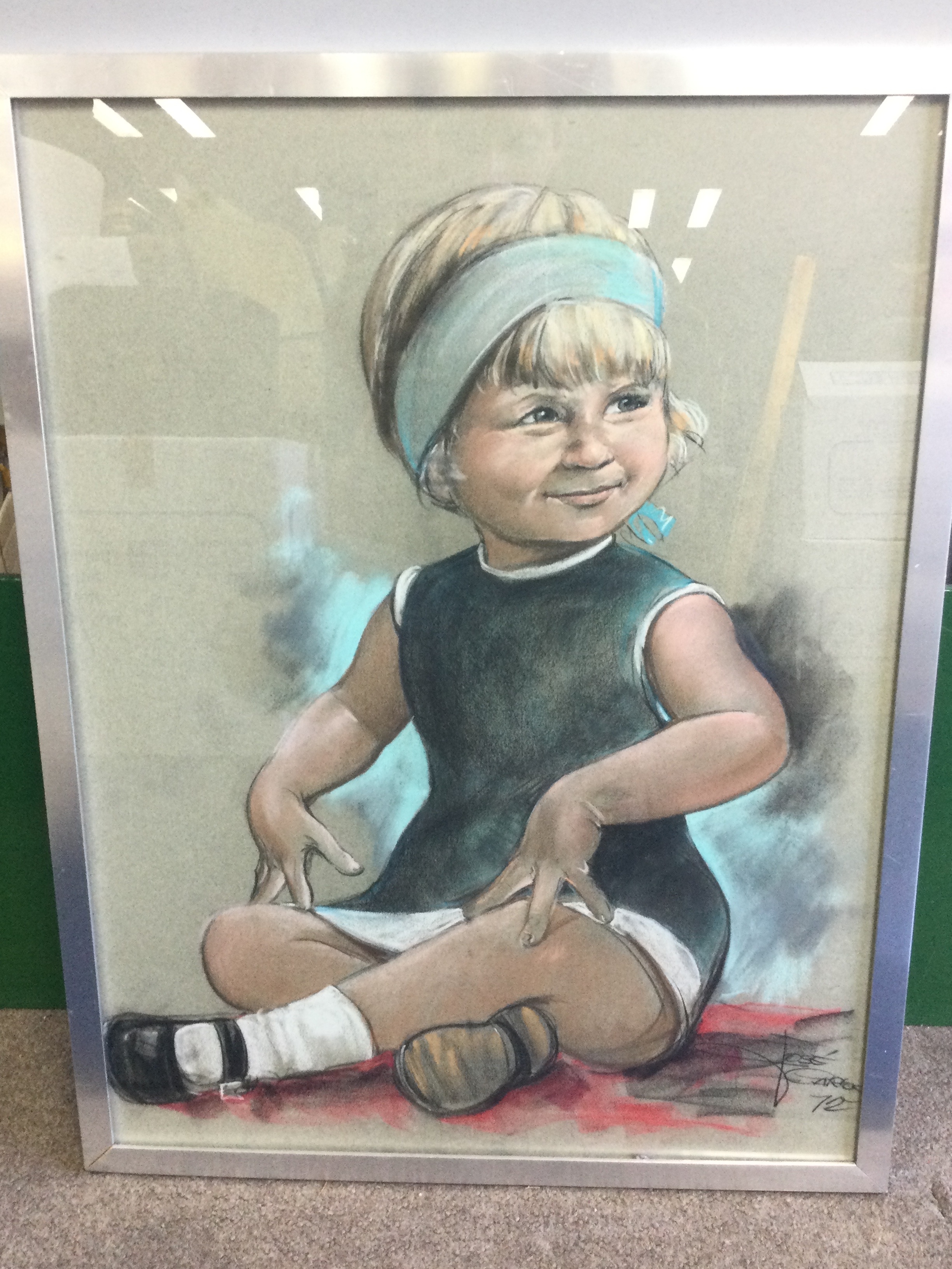 A framed pastel painting, portrait of a young girl signed José Carlos 1972. Frame dimensions 52x67cm