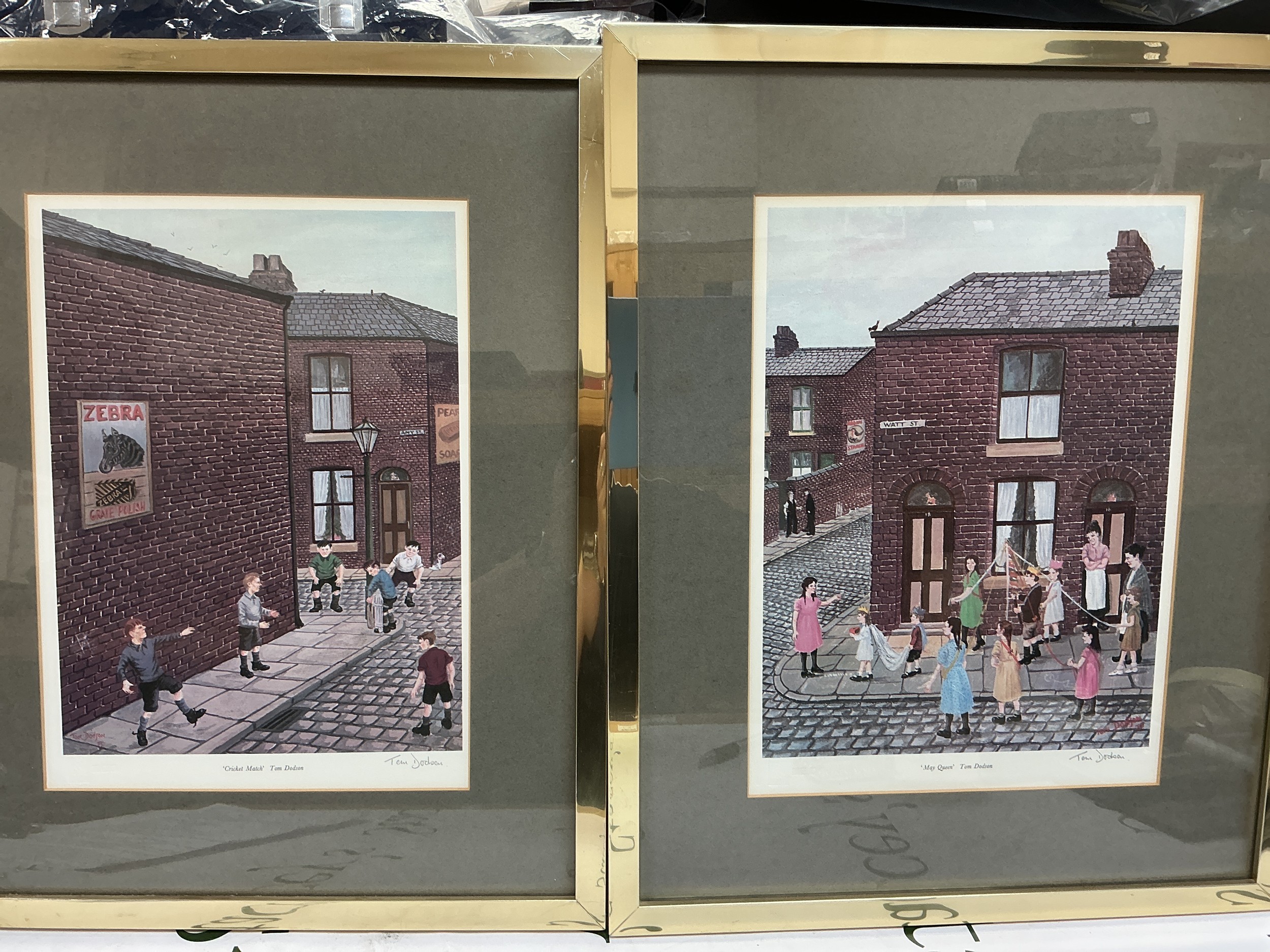 Two signed Tom Dodson prints comprising Cricket Match and May Queen, approx 38.5cm x 47.5cm.