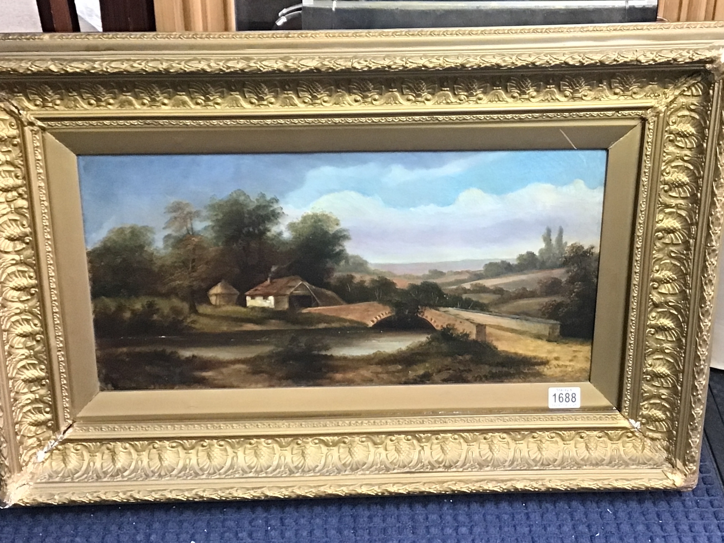  A late 19th century gilt framed oil painting rural view with a bridge crossing a river. 60x87cm 