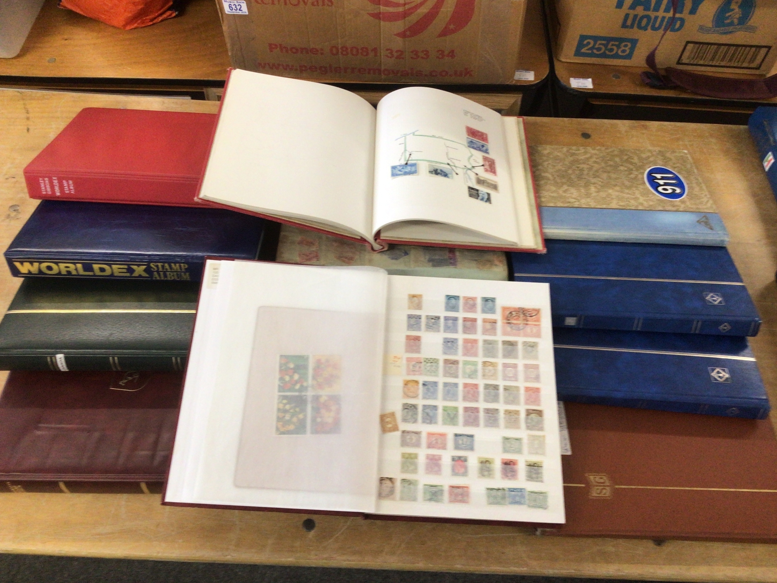 11 albums of World stamps tonic inc well laid out USA Album with artwork.