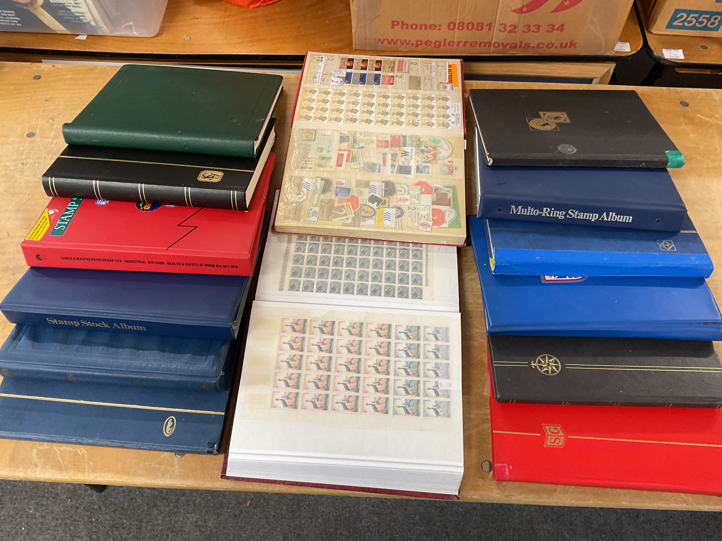 14 albums of world stamps, cancellations, mint and early examples.