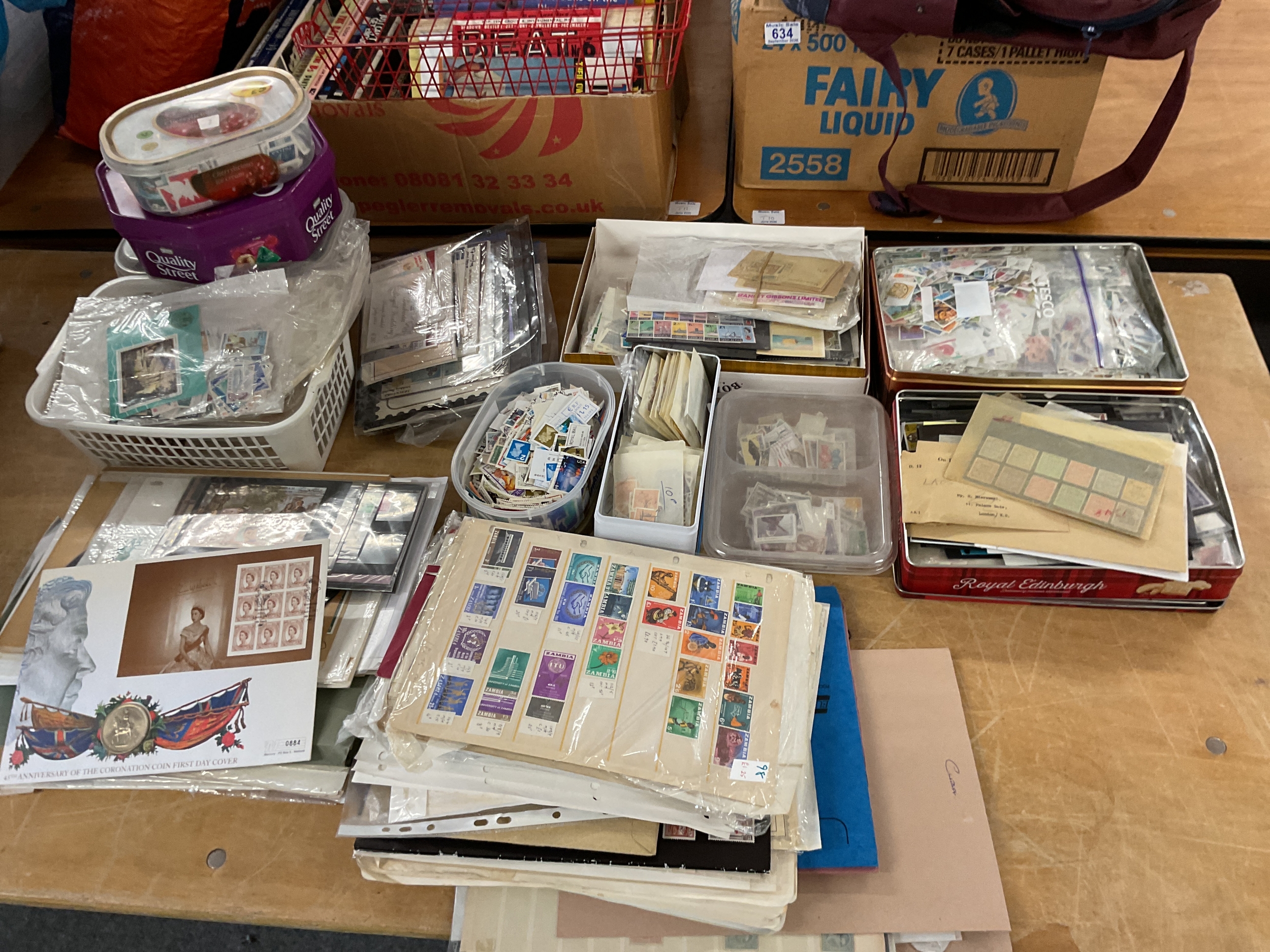 Tins and tubs of stamps, booklets, FDCs, loose and on leaves, and a coin cover.