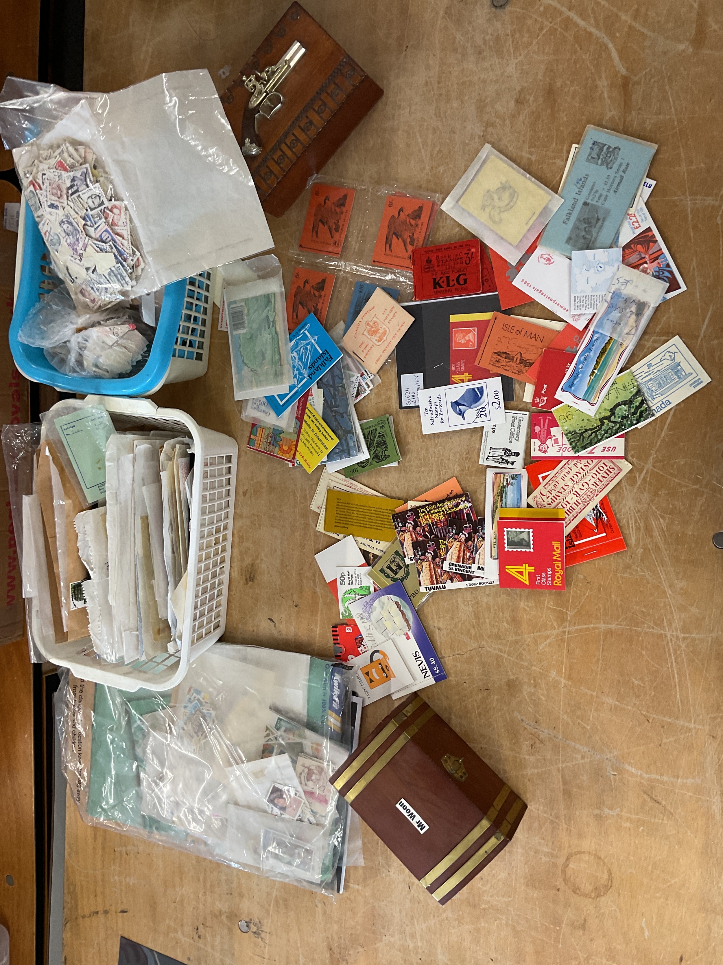 Three drawer cupboard with kiloware stamps and booklets.