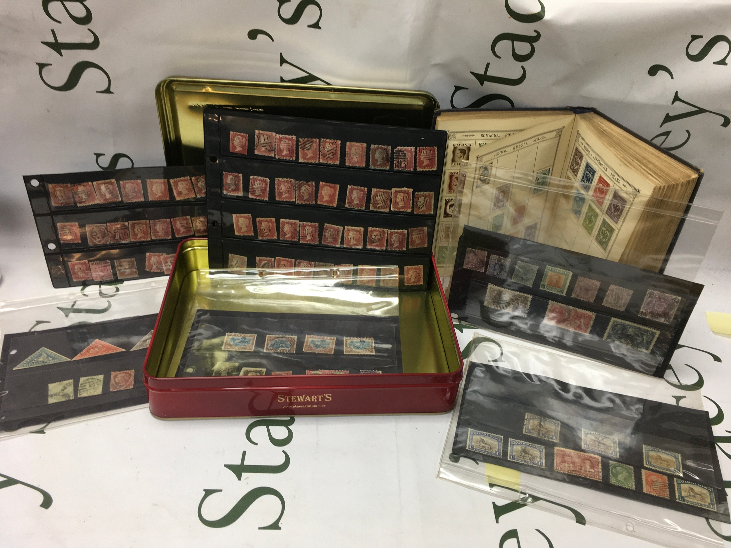 A collection of Victorian stamps, including penny blacks. 