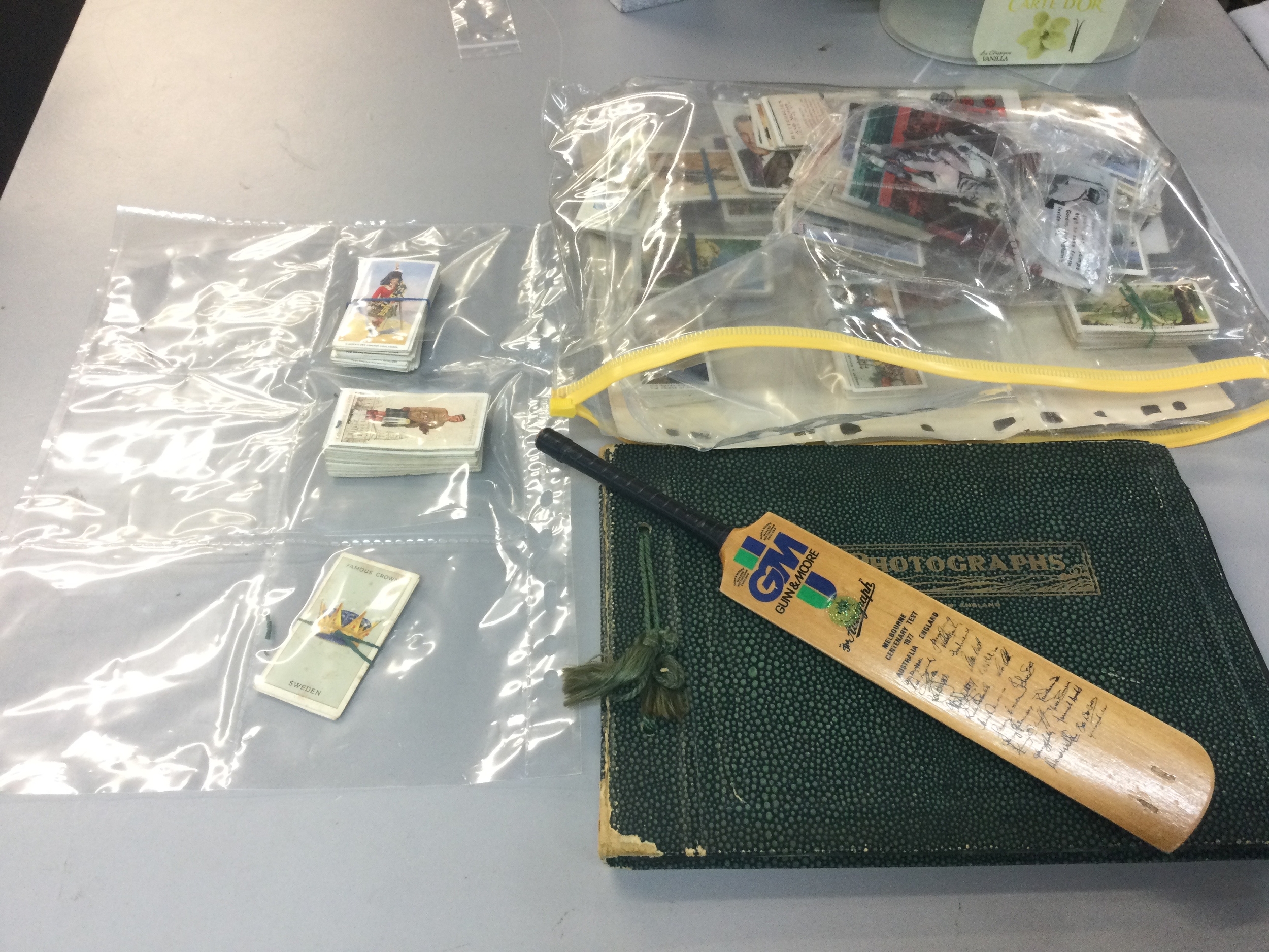 A quantity of cigarette cards, mini bag and postcards 