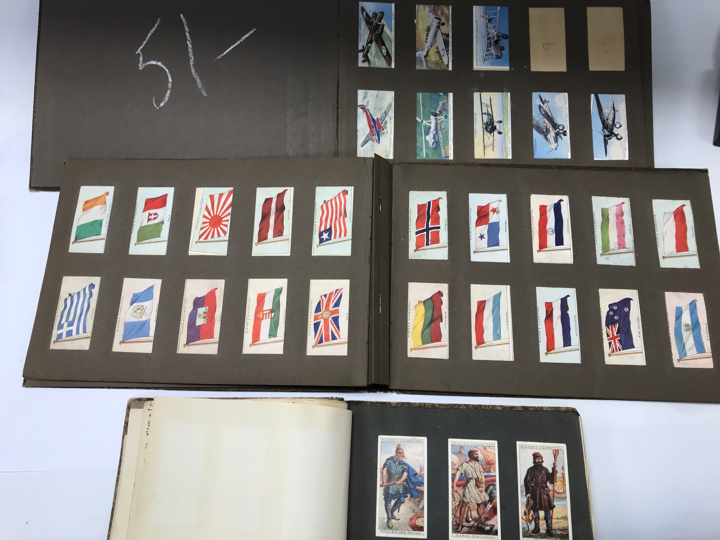 Collection of three cigarettes card folders.
