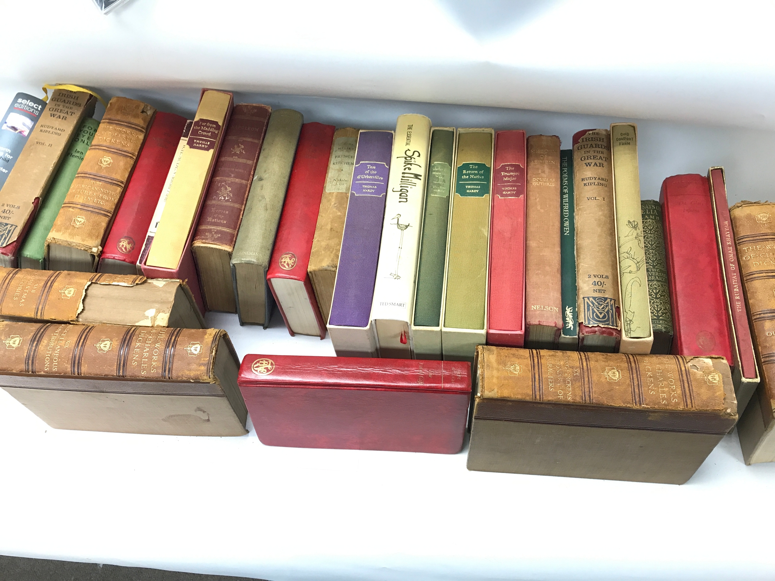 large collection of mixed vintage and antique hardback books with various cloth and leather-style bindings.   