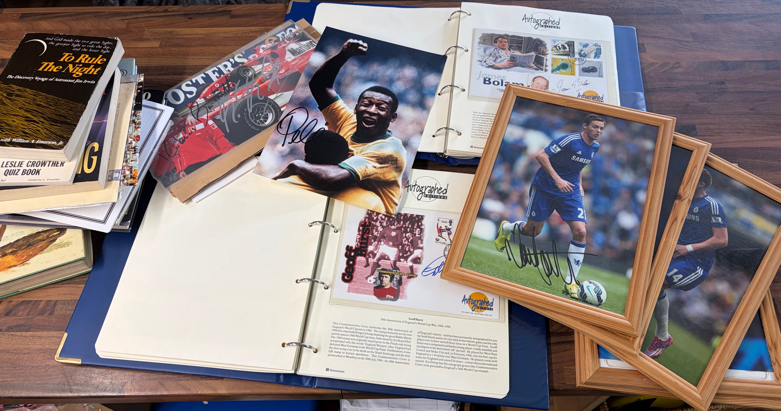 a collection of various autographed items including books, photos and 2 containing autographed editions first day covers by various people including margaret thatcher, norman wisdom, bobby charlton, stirling moss