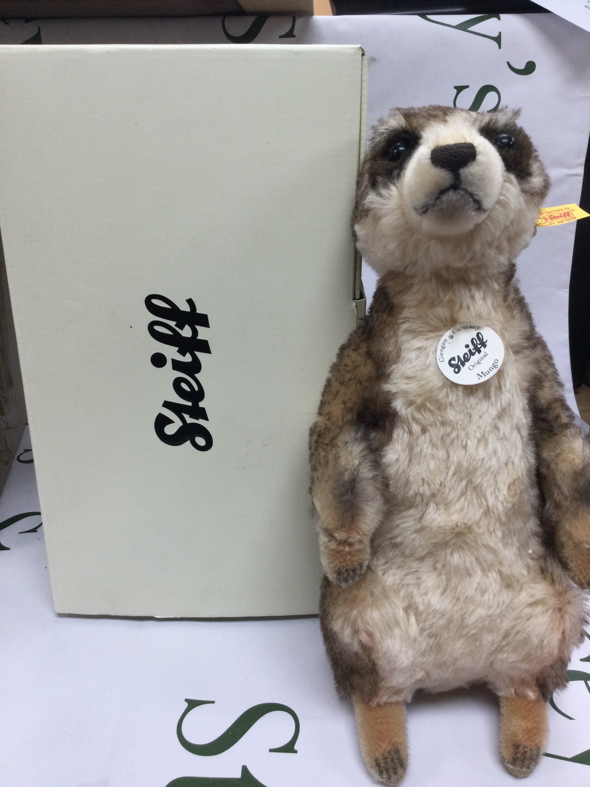 A boxed Steiff meerkat. Height 32cm. 
