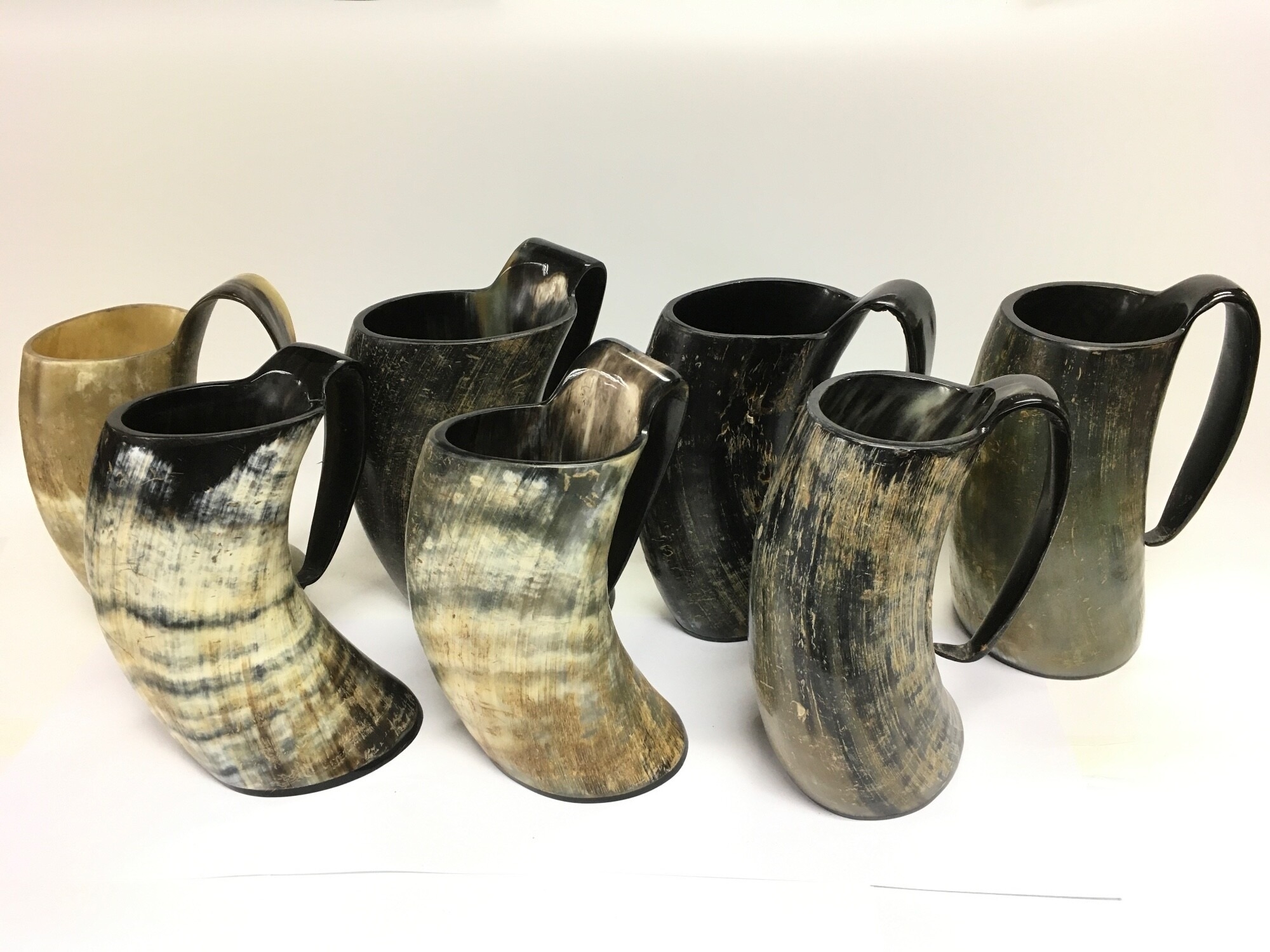 Seven cow horn tankards, approx height 23cm.  NO RESERVE