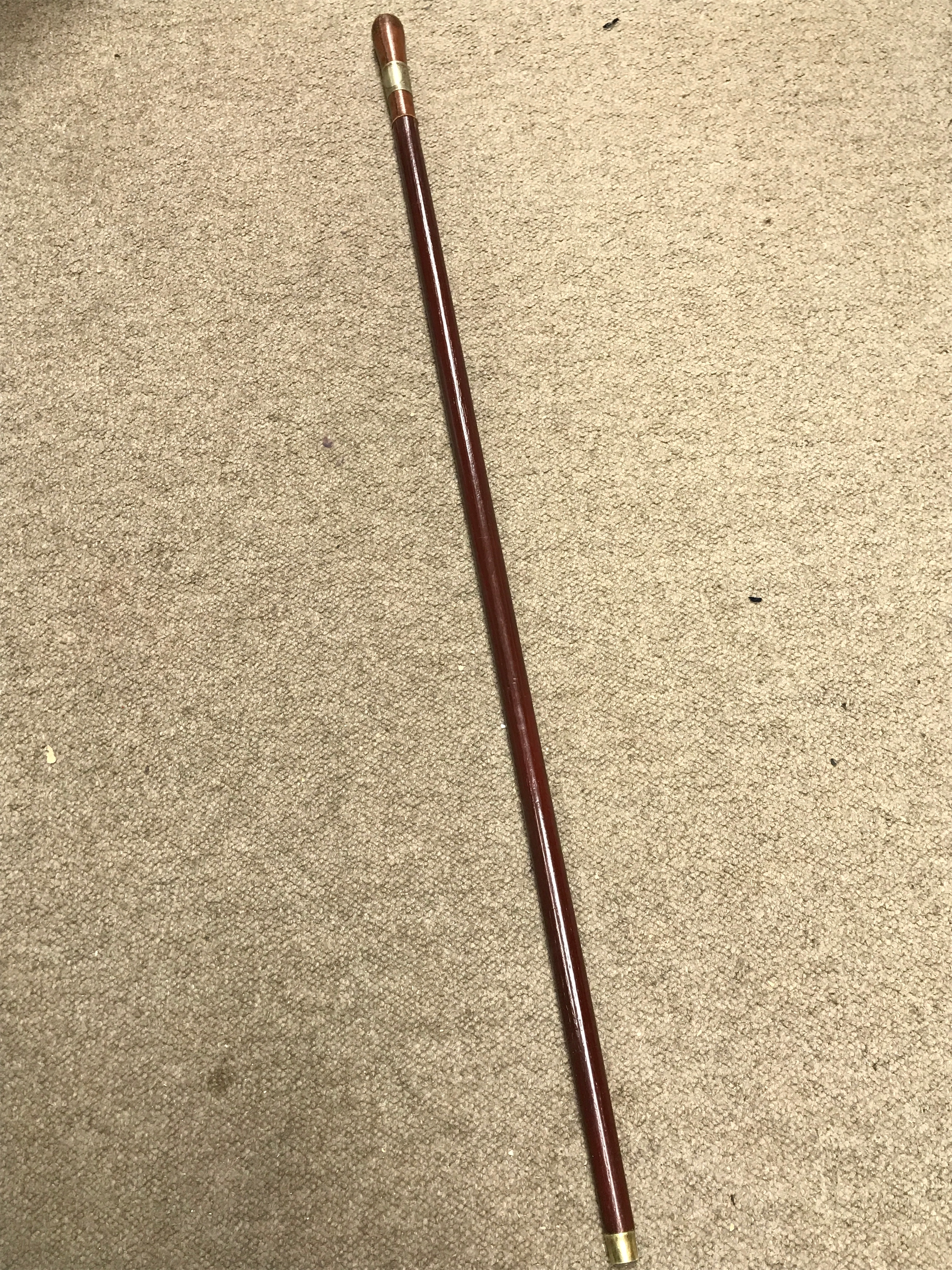 a leather top wooden shaft sword stick. Blade 63cm long. Total length 99 cm