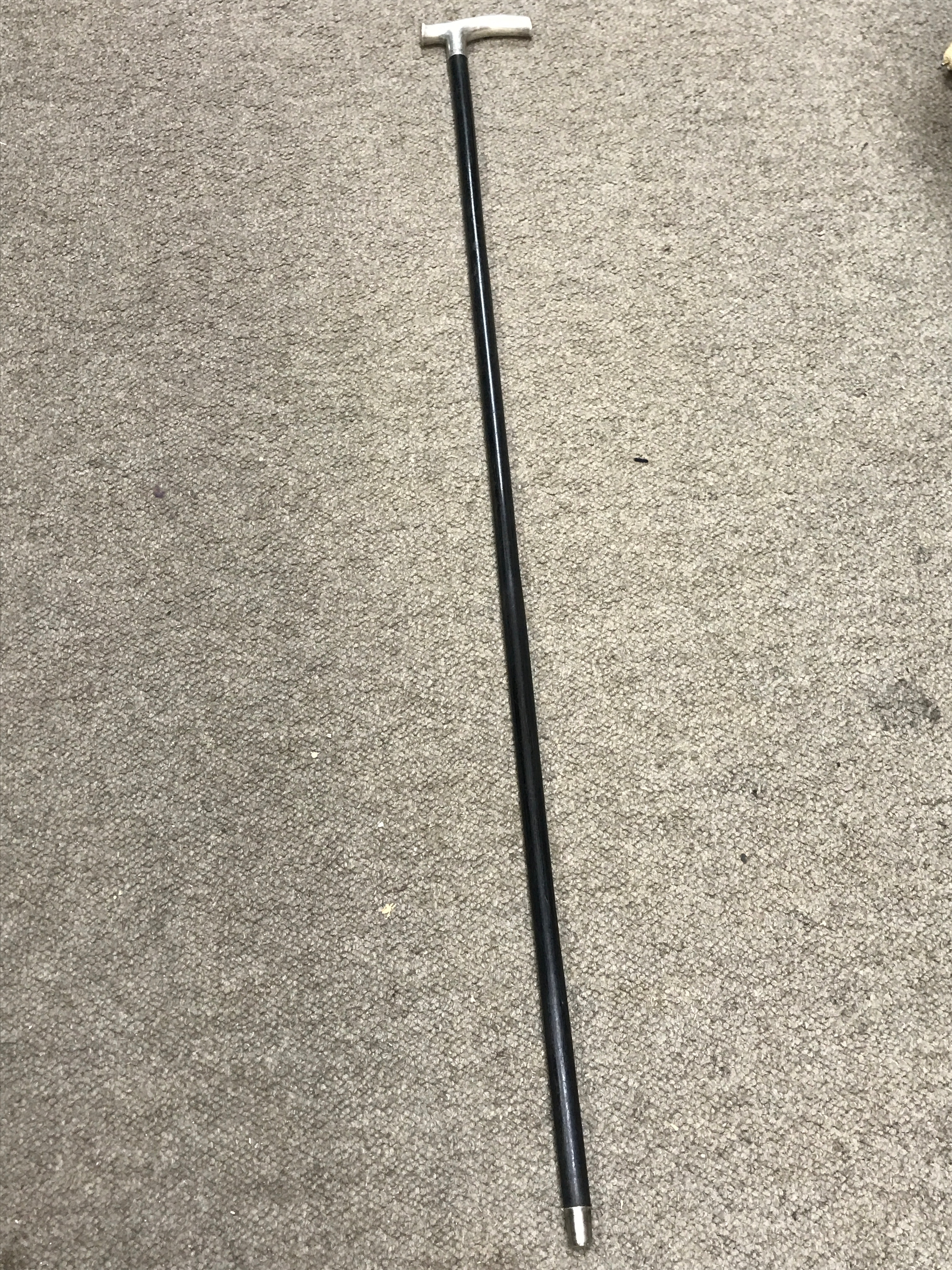A black hardwood shaft silver hallmarked top sword stick 55cm long blade, 89cm total length 