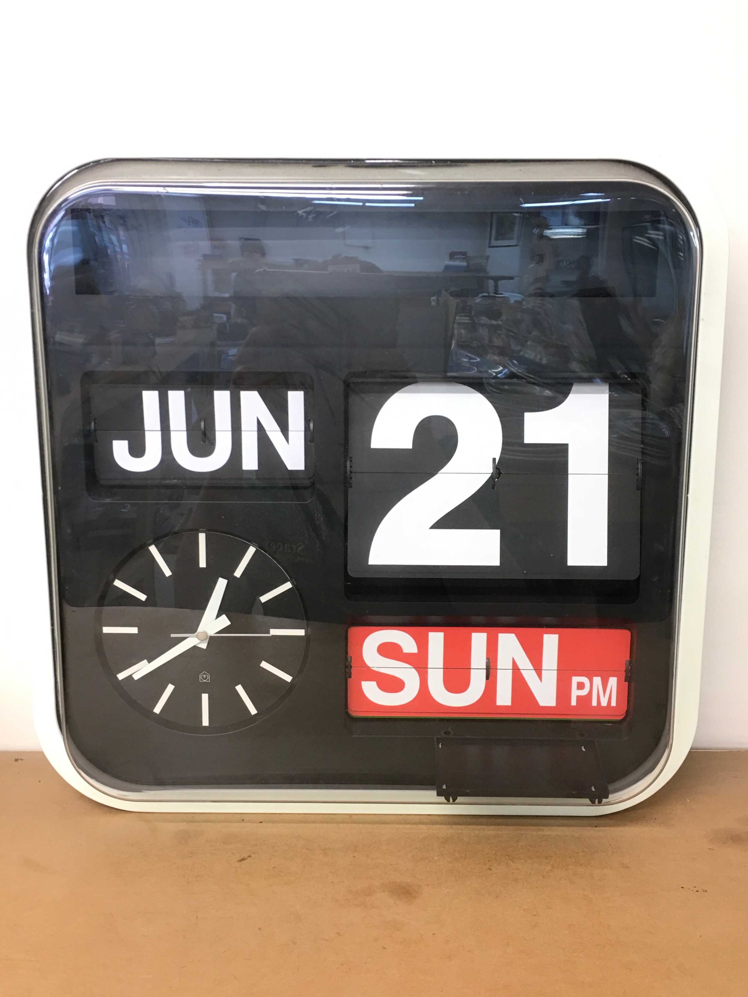 A vintage style battery operated wall clock, 43cm wide 42cm tall 