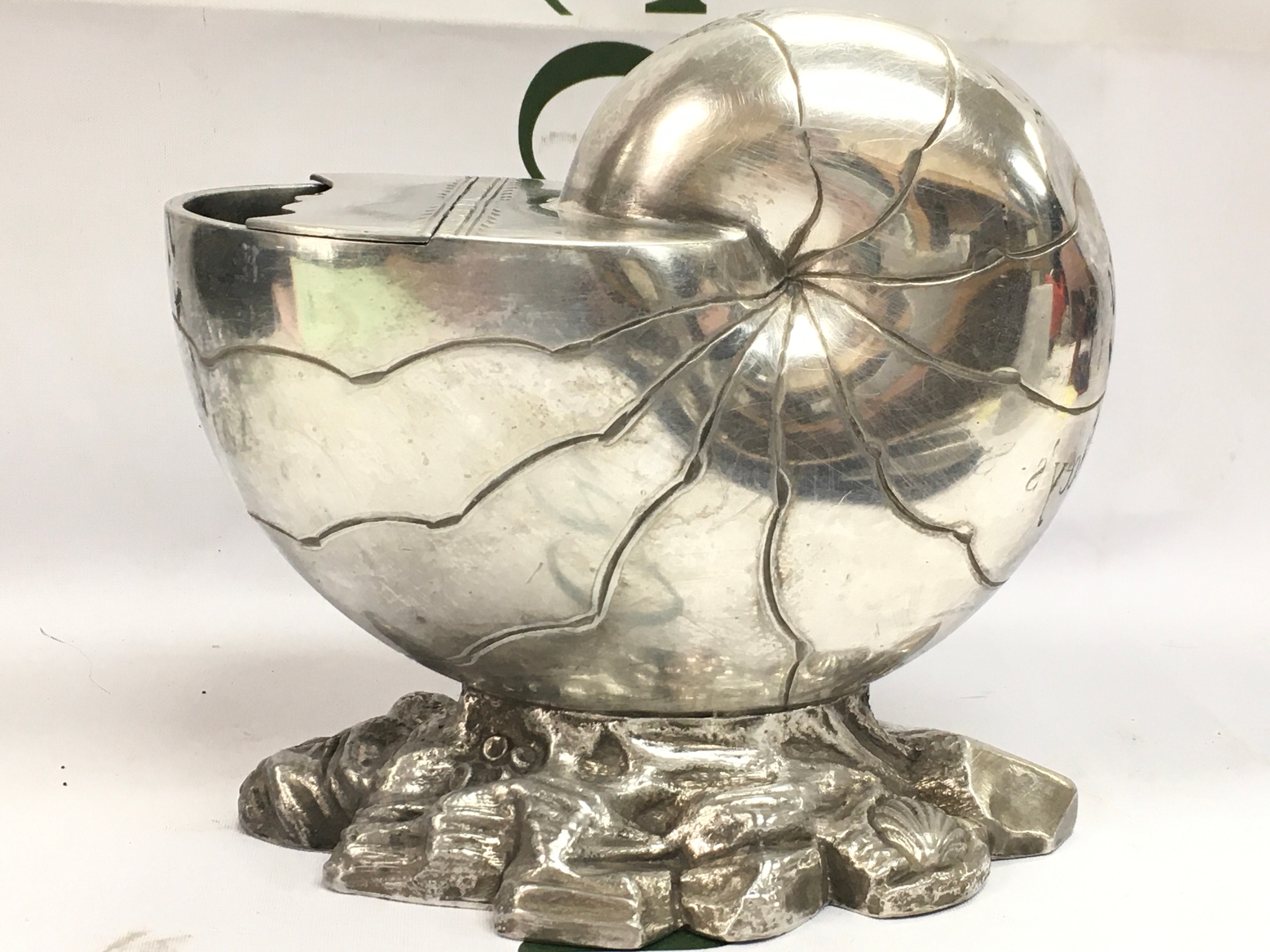 A shell spoon warmer , 15cm tall