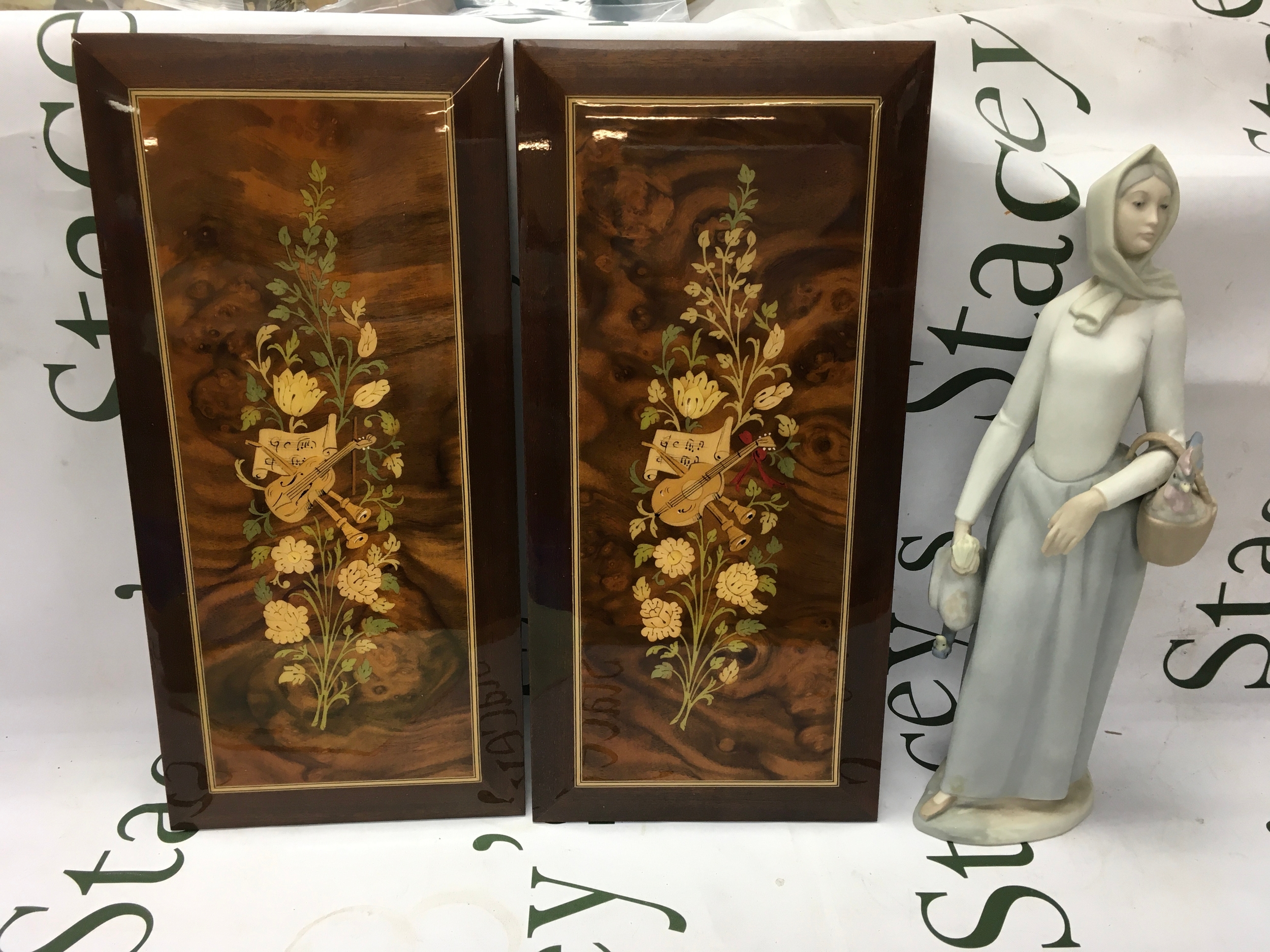 Two inlaid panels and a Spanish figure 