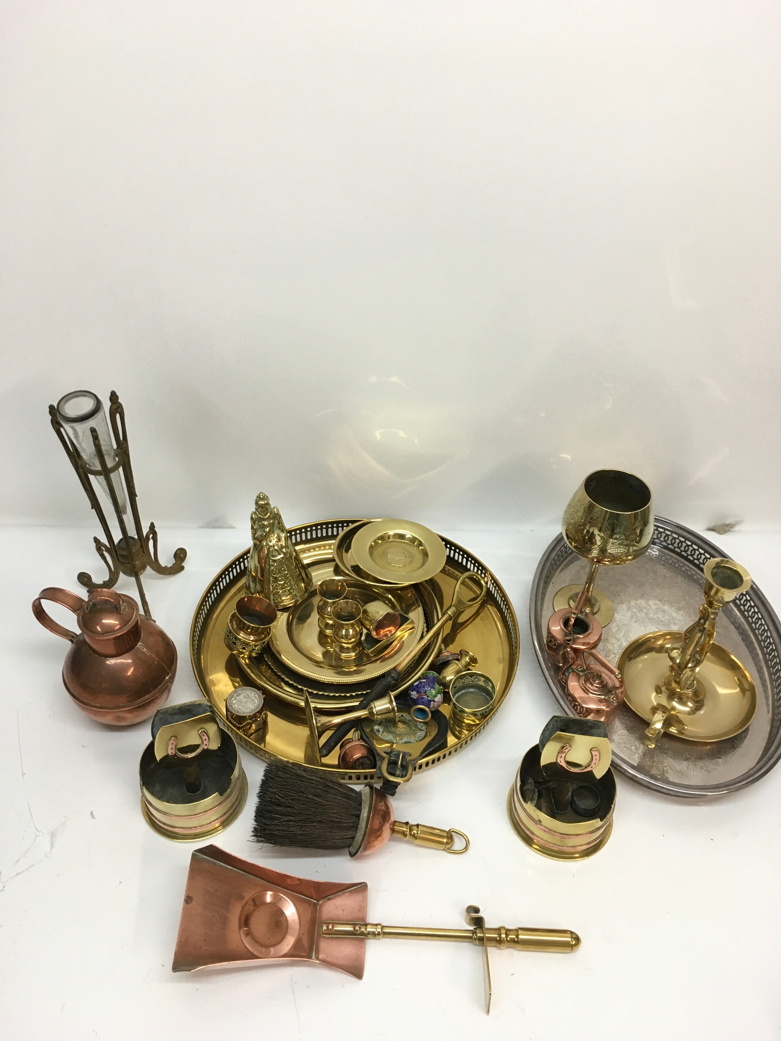 A collection of brass and copperware