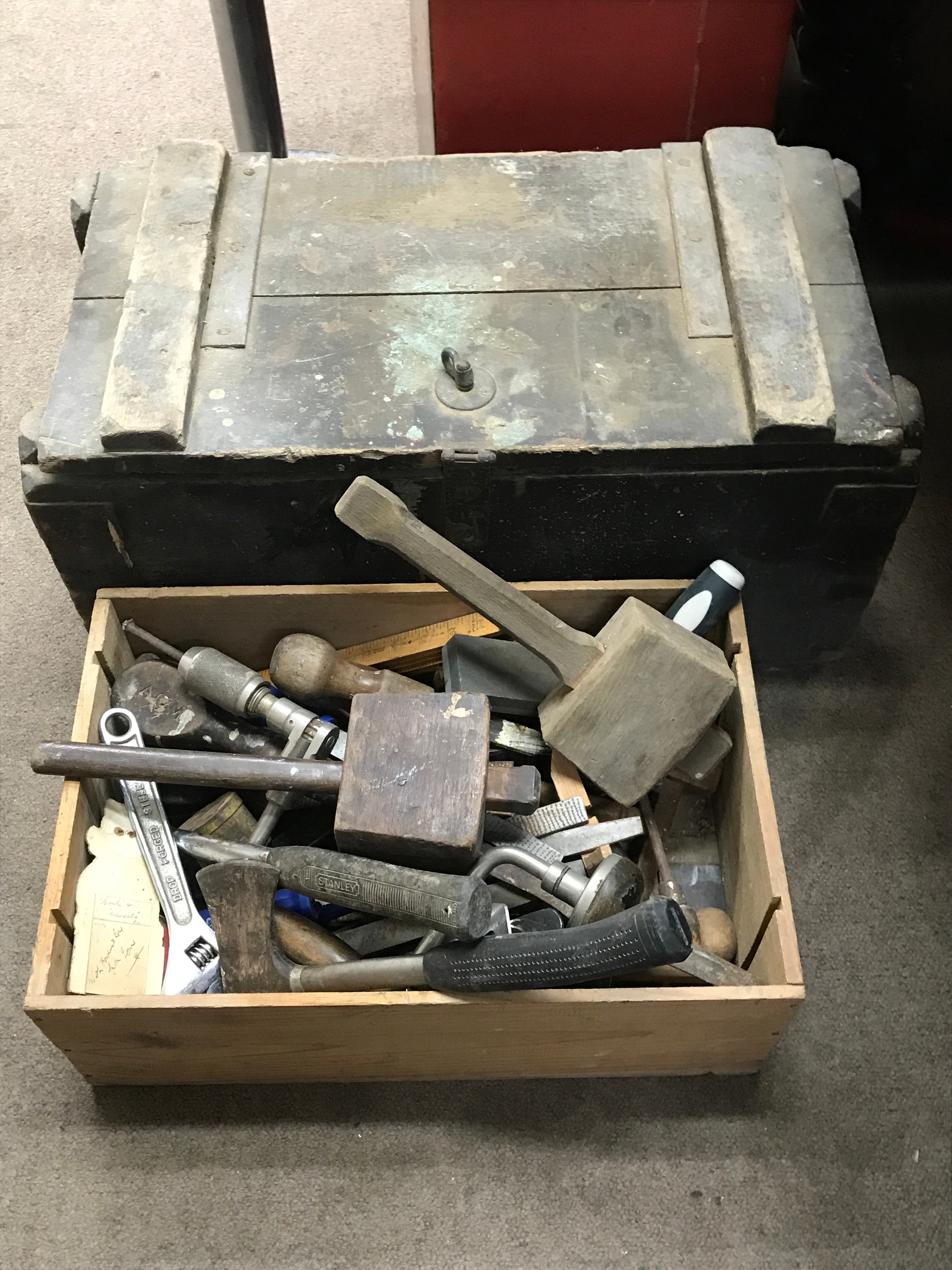 A Collection of tools and a wooden storage crate