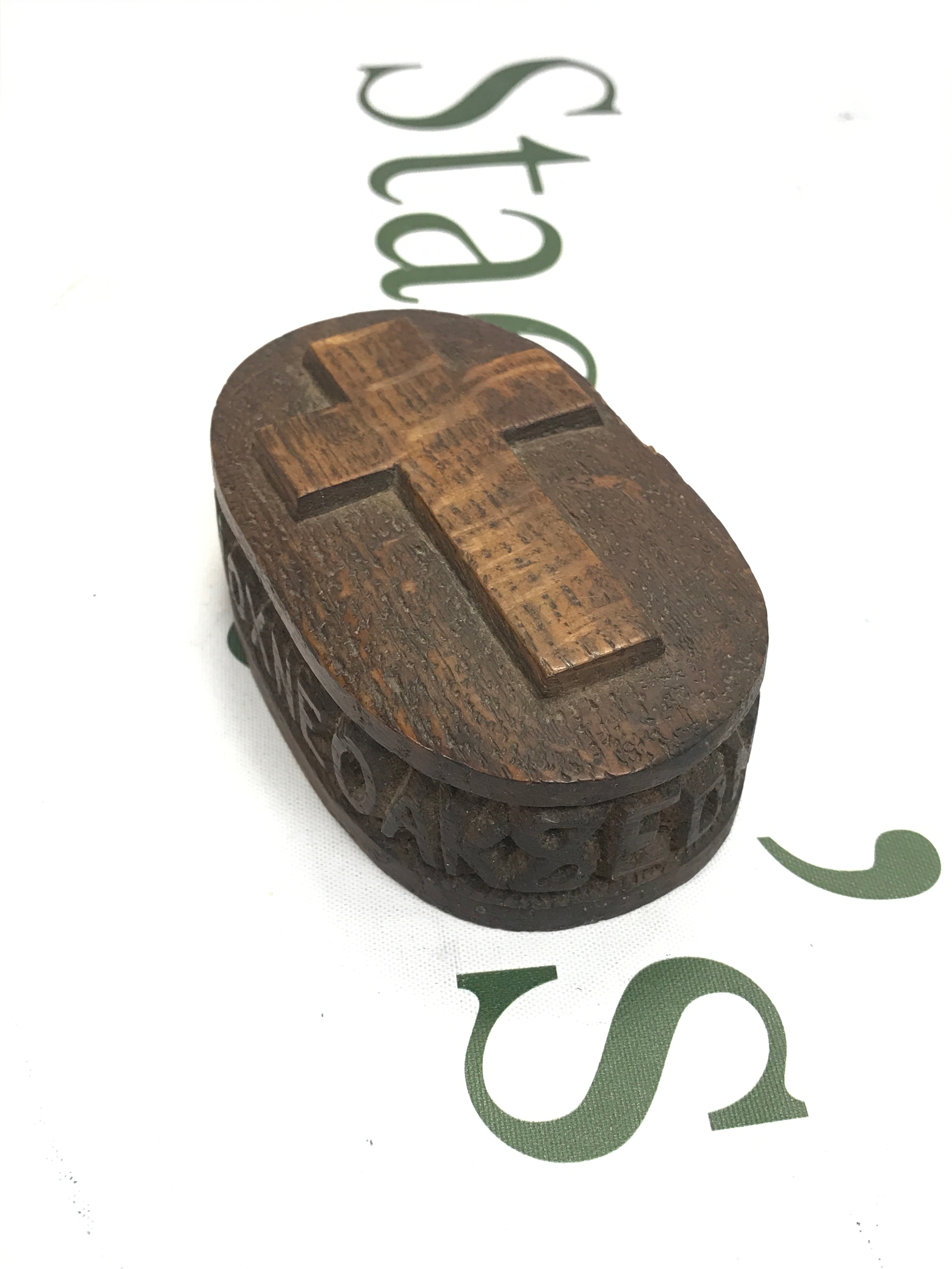 A Black Forest box with hidden compartment covered by metal plate on the base, probably urn. Carved text around: 870 the Horne oak & Edmund Martyrad 10cmx 6cm x4cm