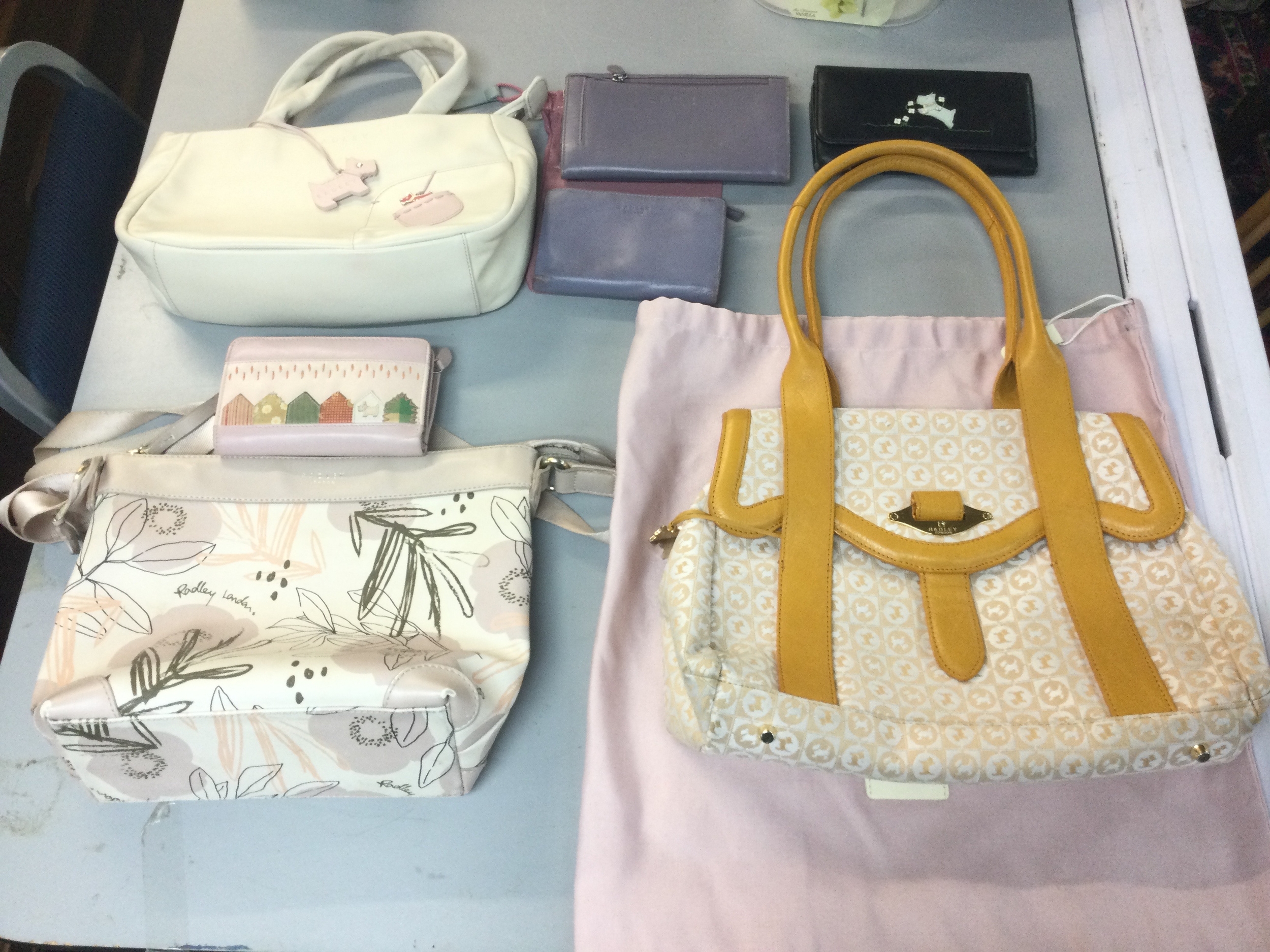 Three Radley bags and four purses