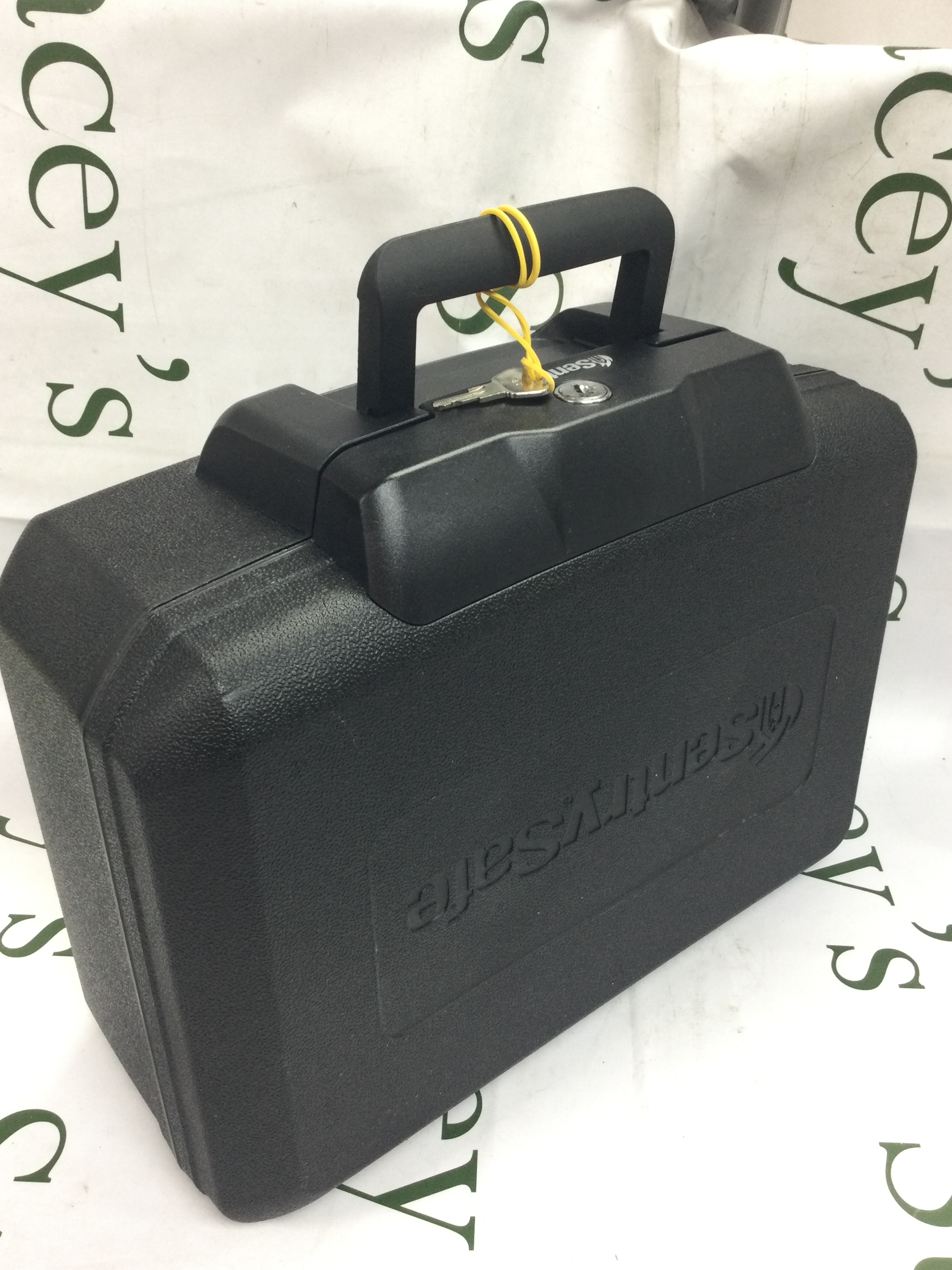 A large fire resistant money safe with a key, 35x28x16cm exterior dimensions 
