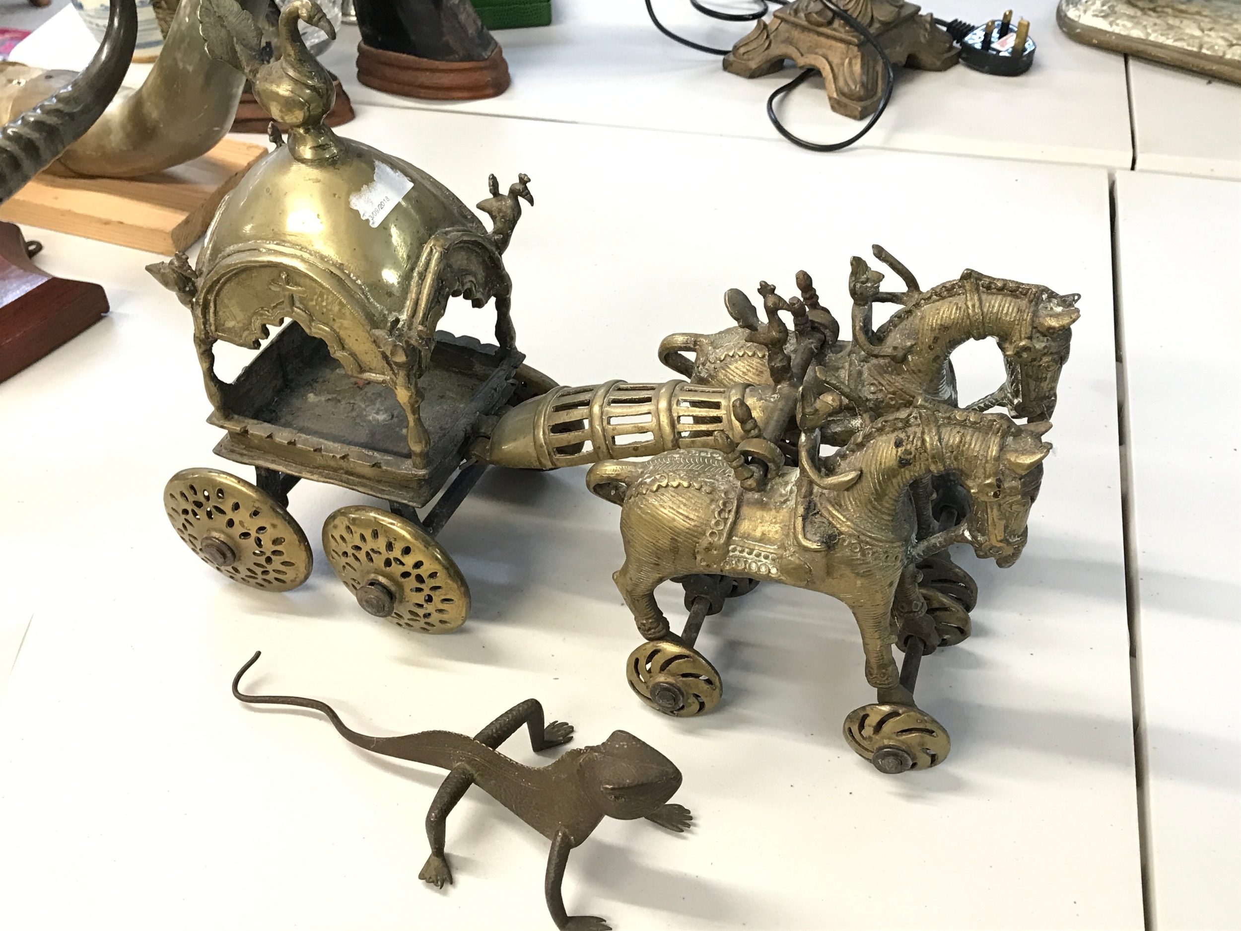 A brass model chariot (38cm long)and a lizard figure (23cm long) 
