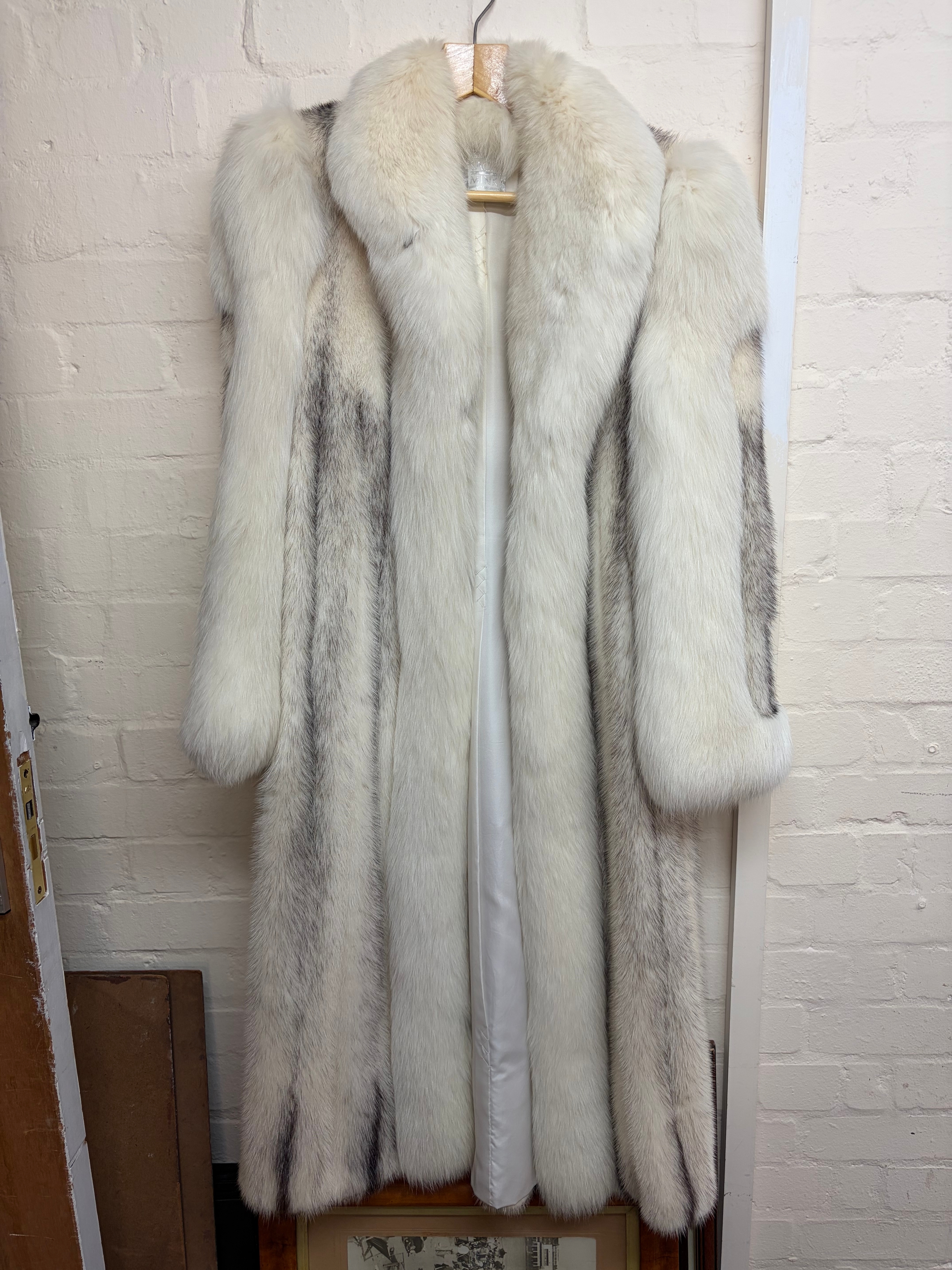 A full length two tone fur coat 