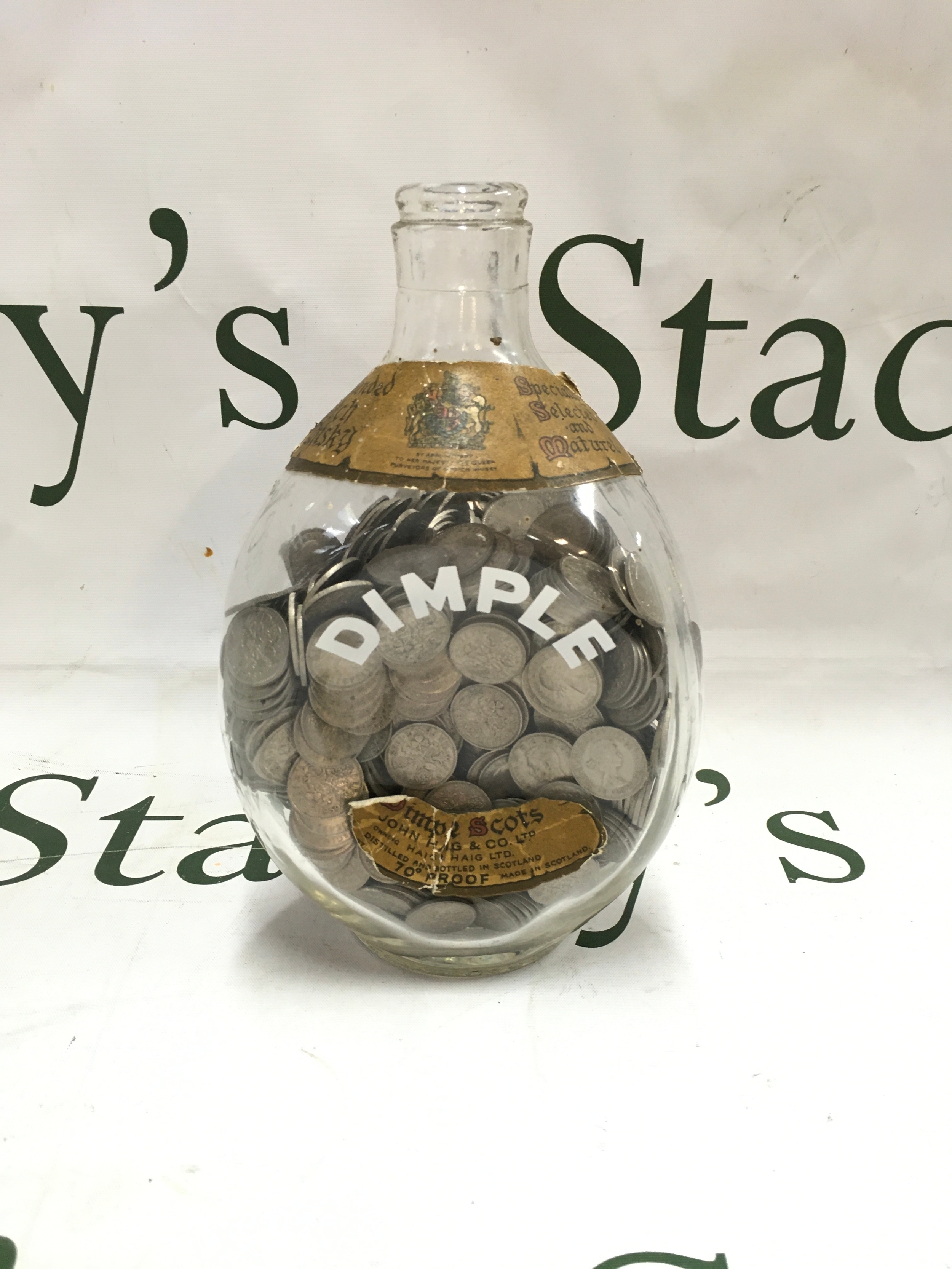 A jar of sic pence pennies 