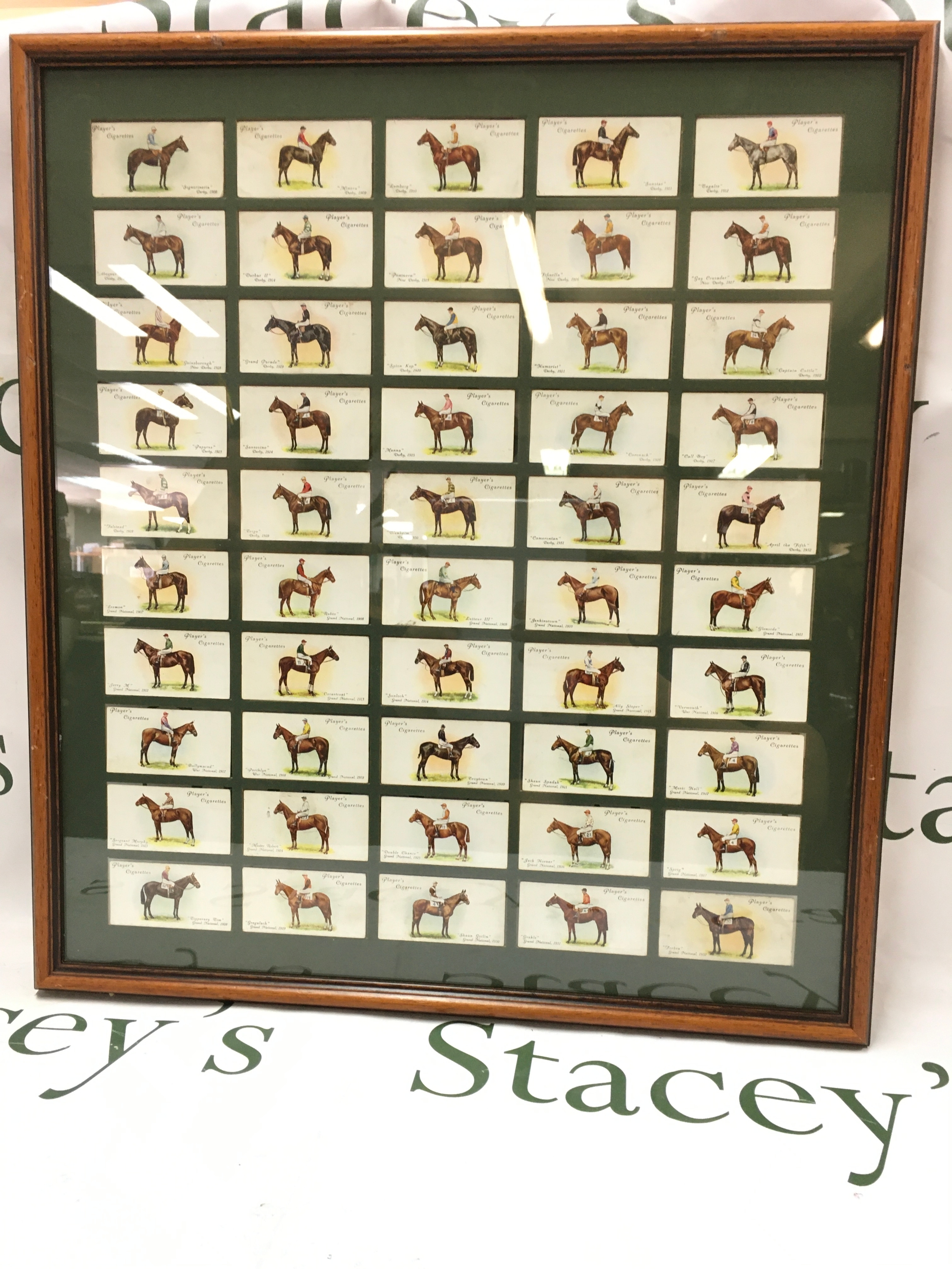 Five framed cigarette cards