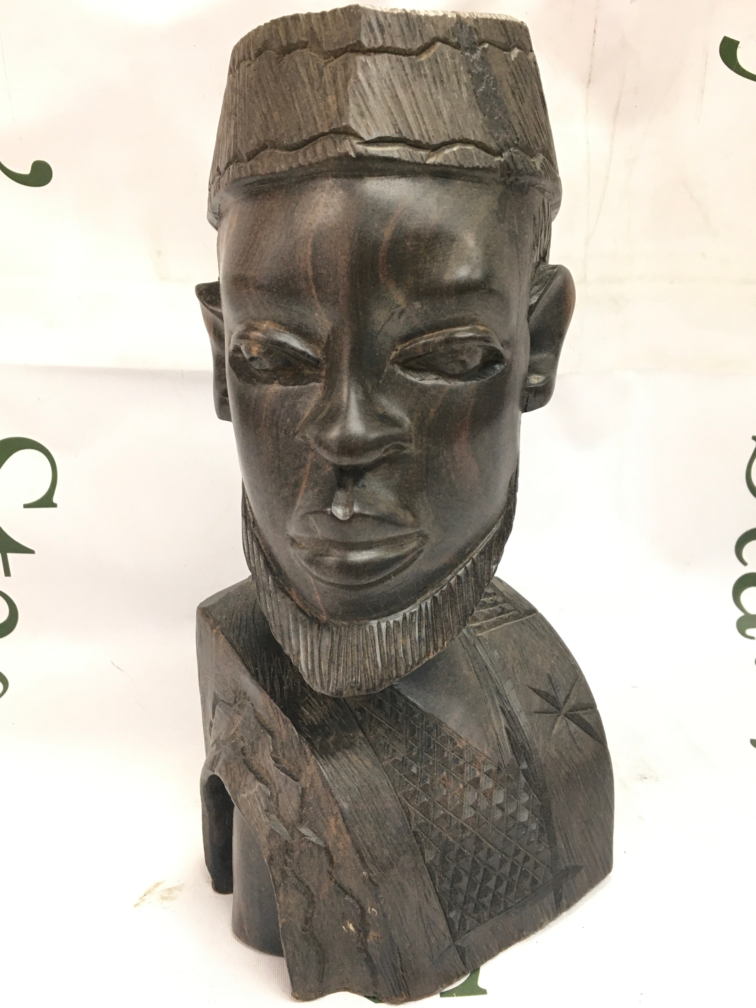 A heavy carved wooden African bust 26cm tall