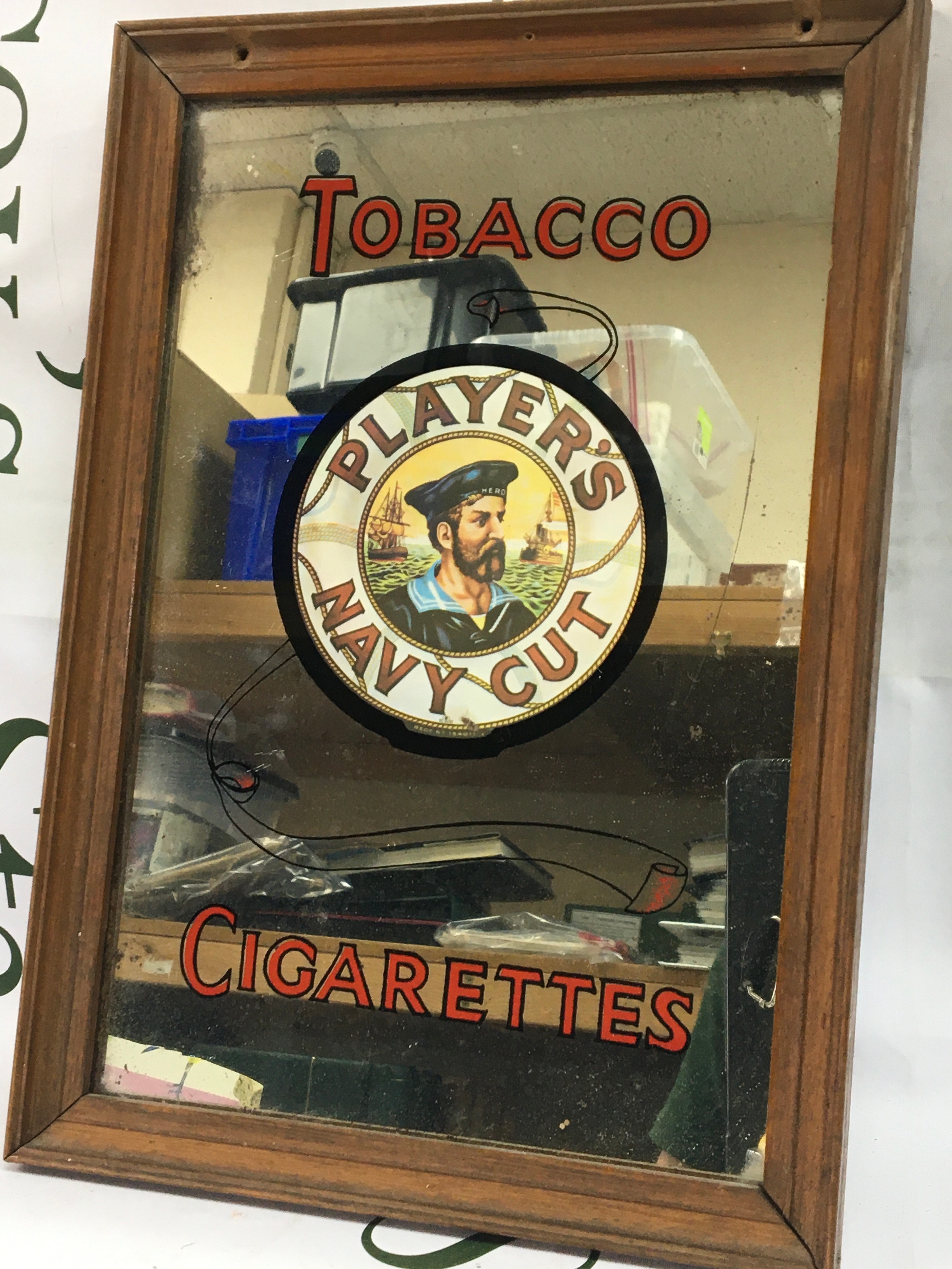 A vintage framed small advertising mirror players Tobacco cigarettes. 24x34cm
