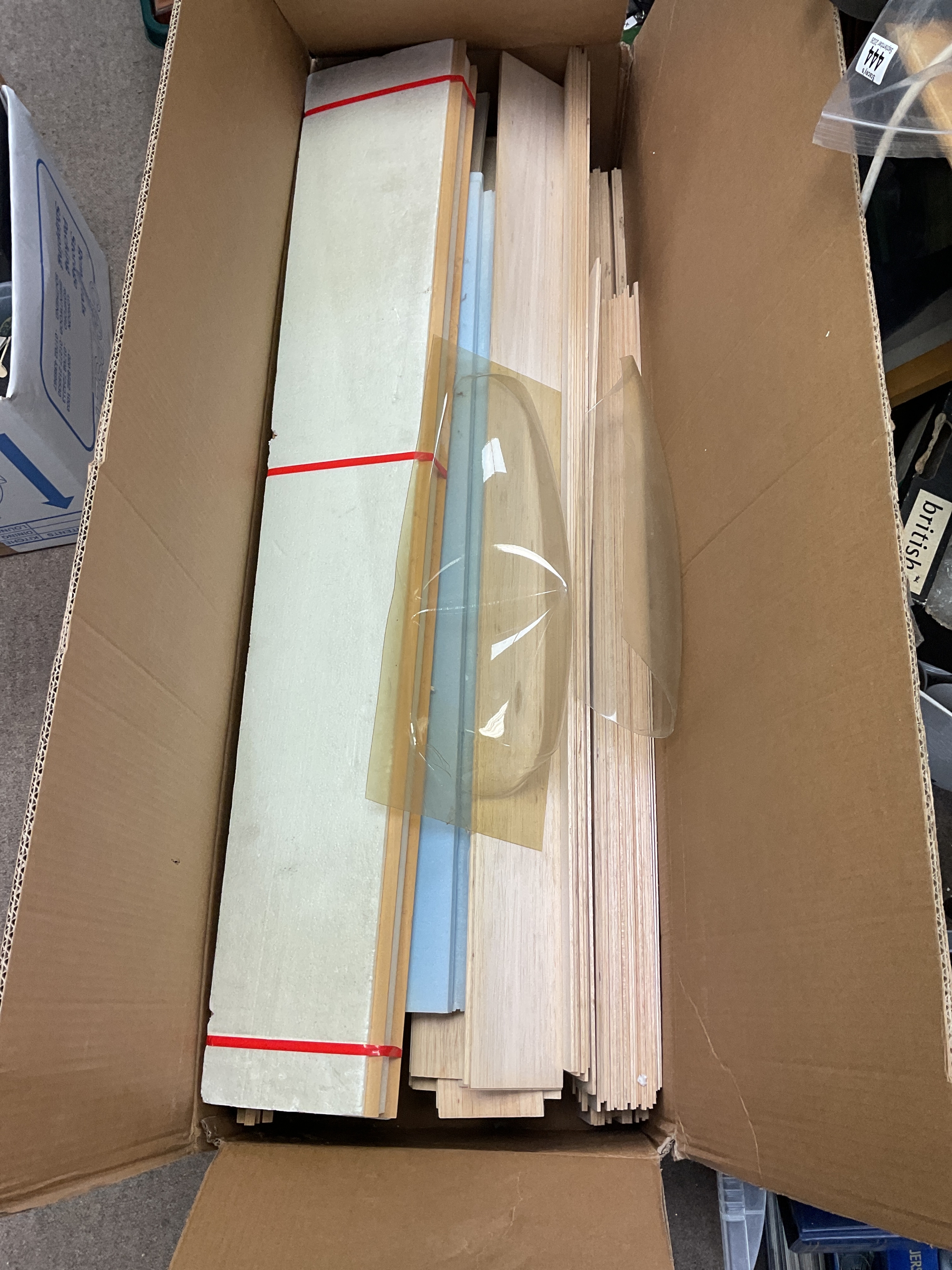 Model making glider wings and two cockpits along with long lengths of unused Balsa wood.