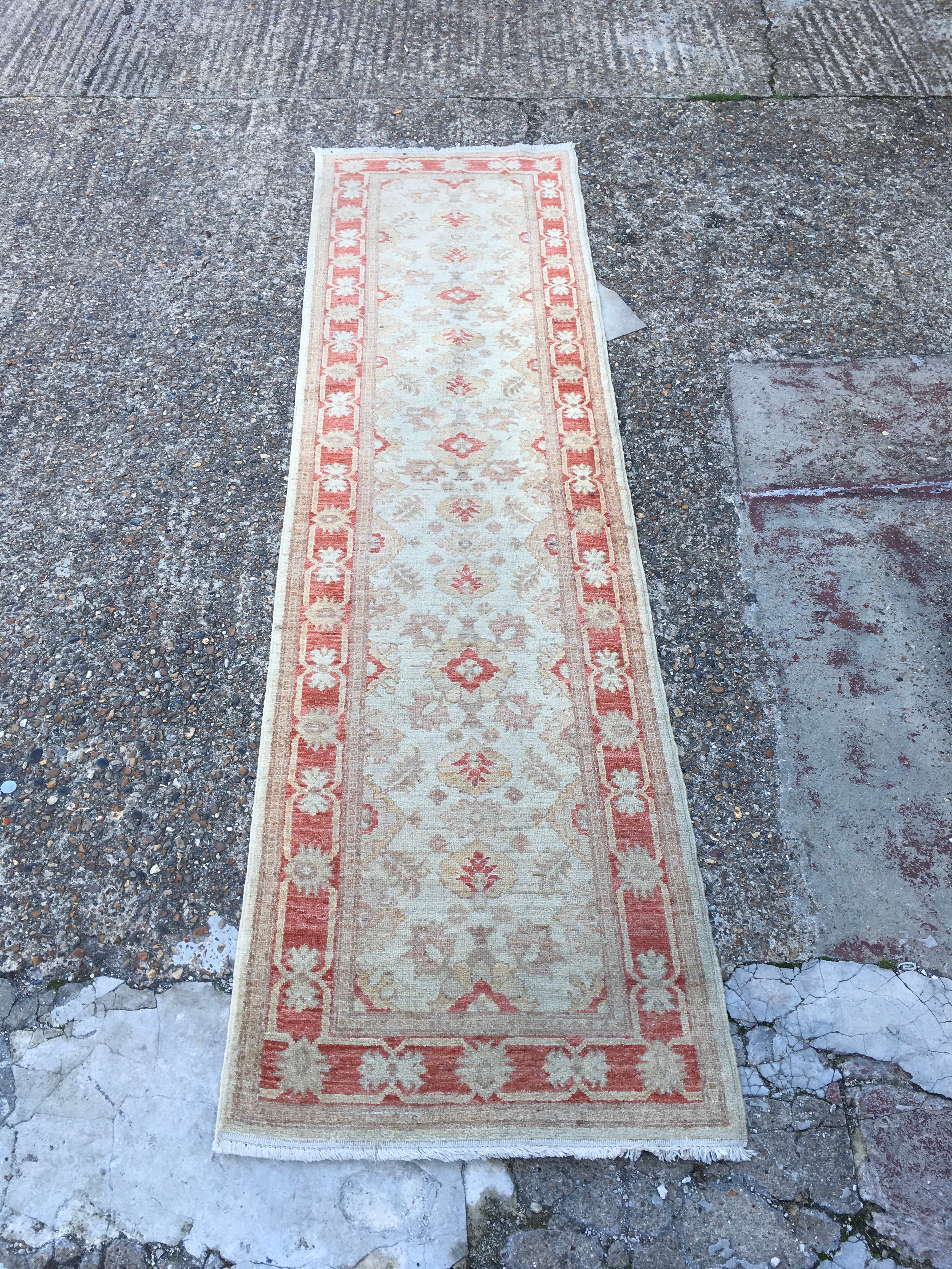 A collection of 3 rugs. Length 290cm, Width 79cm. Length 250cm, Width 57cm. 