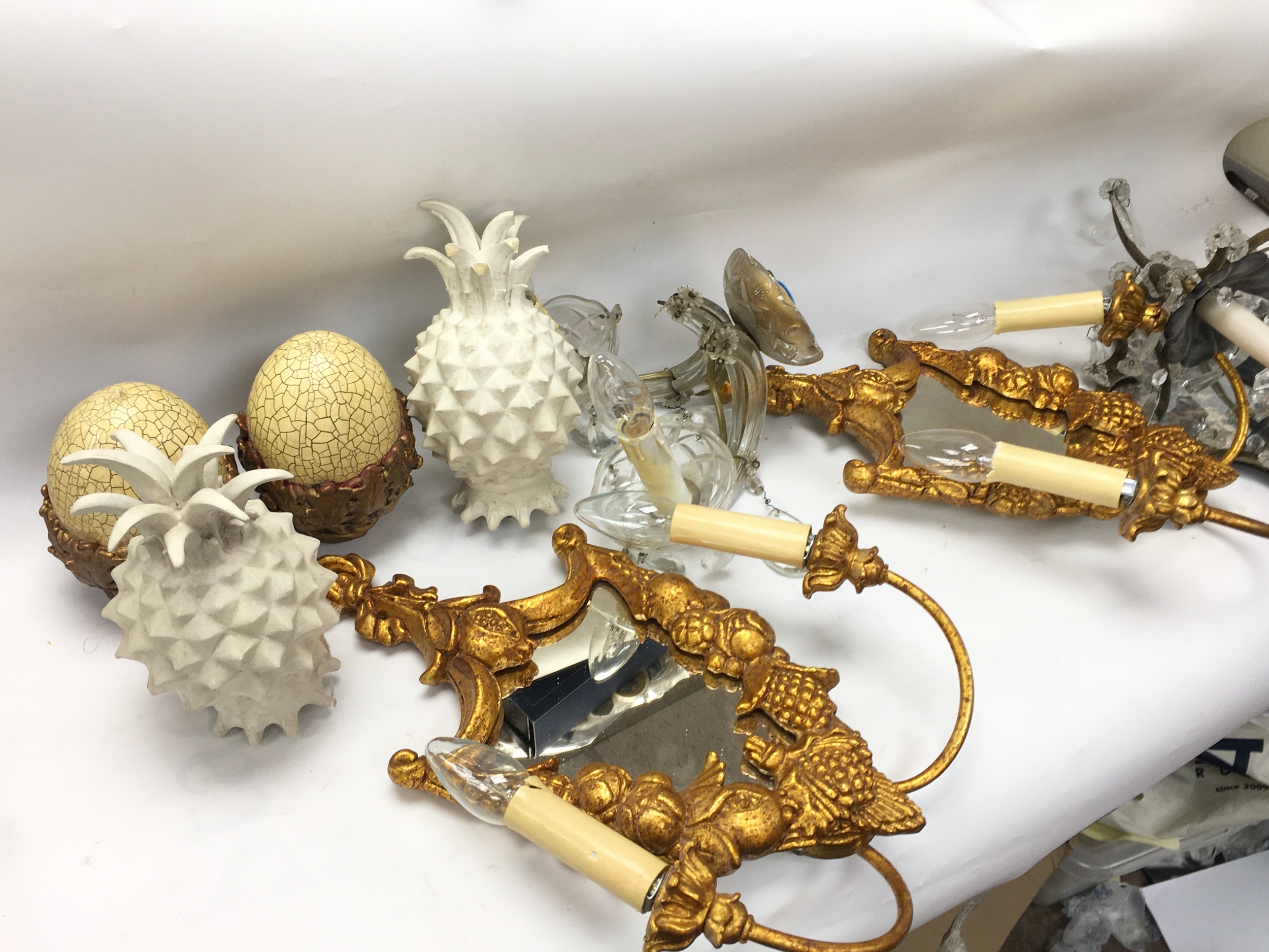 Interior design pieces including lights and curtain finials