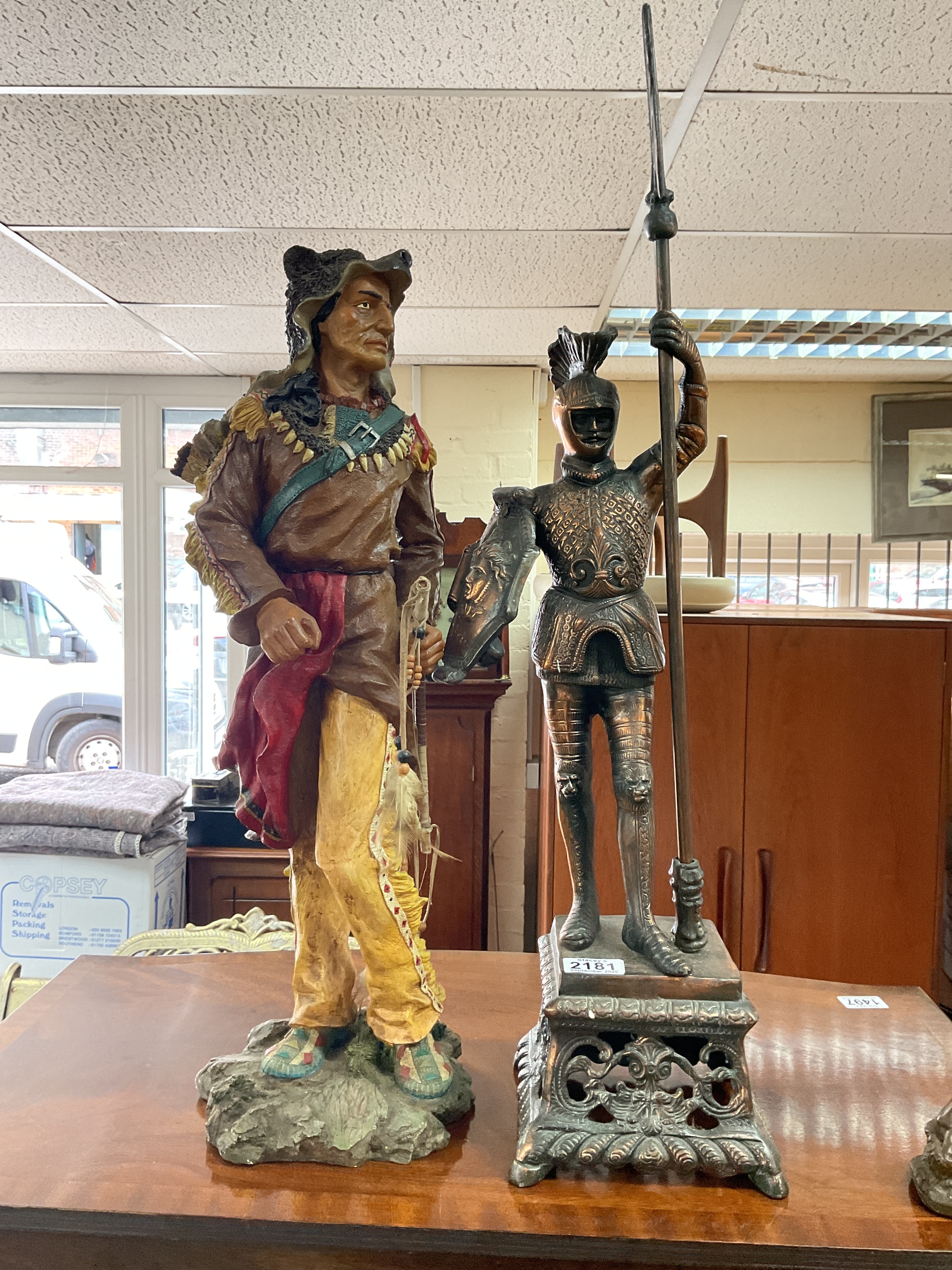 Large metal knight figure along with a resin Indian figure approx 60 cm.