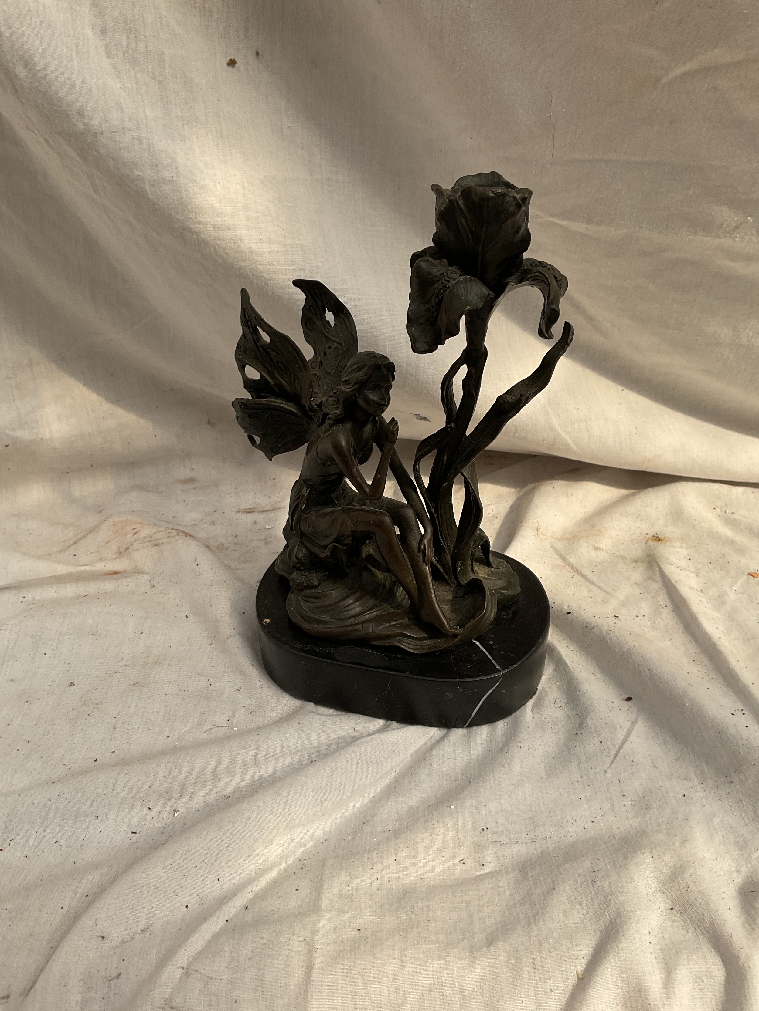Milo bronze figurative candlestick as a Fairy and an Iris forming the sconce, signed and on marble base H 22 cm.