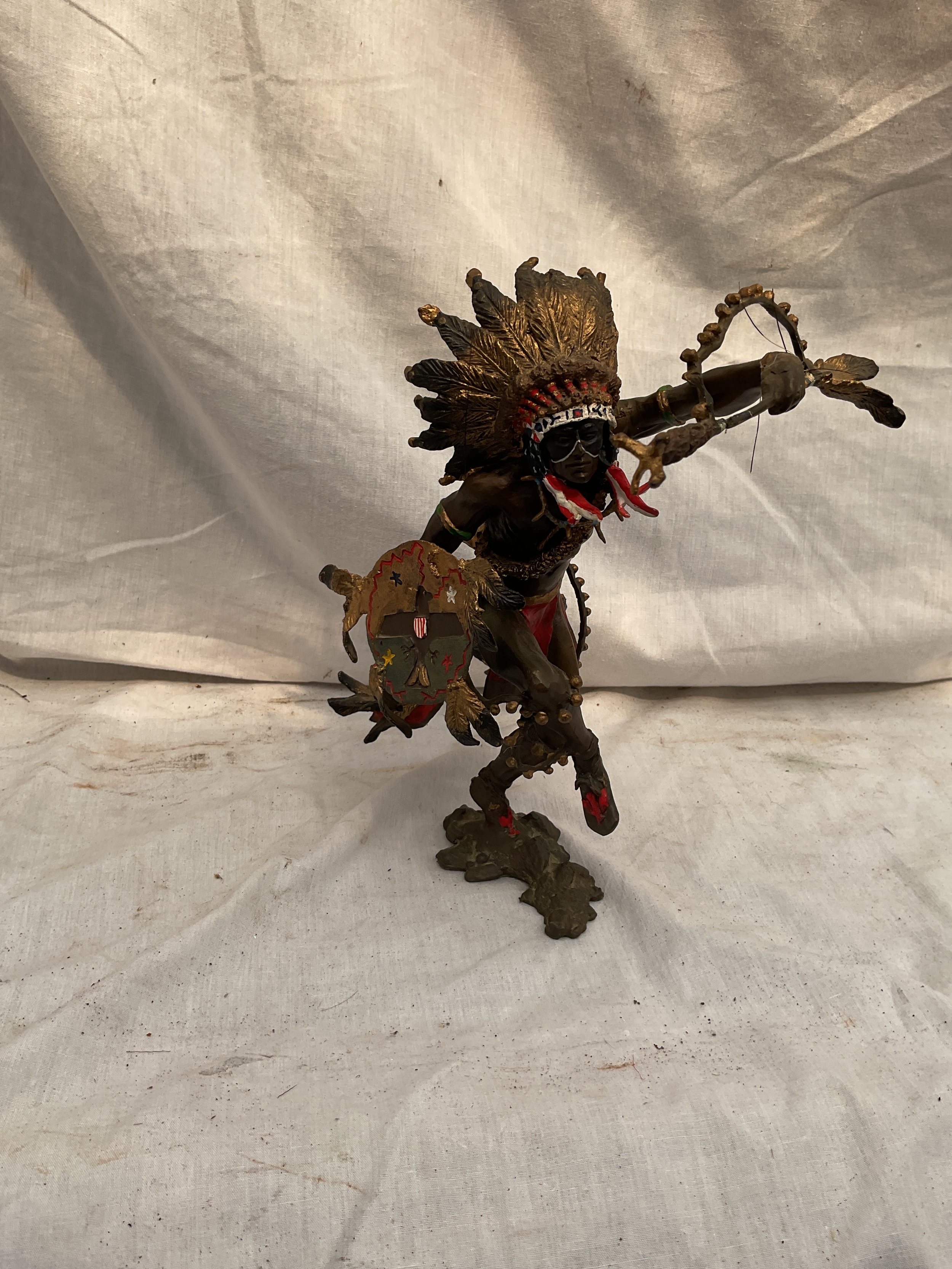Painted bronze of a Native American