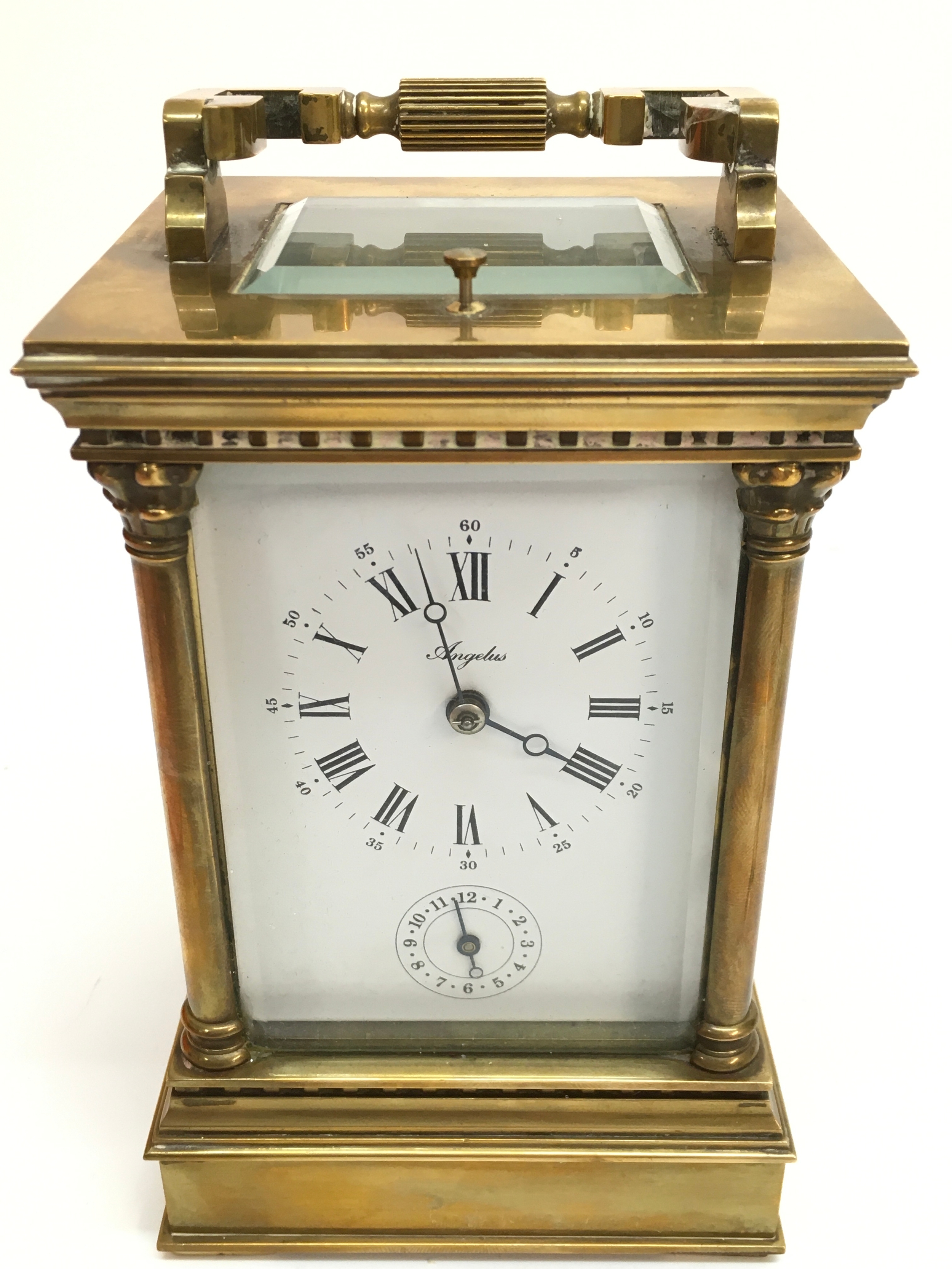 A strike repeat carriage clock, not seen working . 17cm tall, 10cm wide, 9cm long